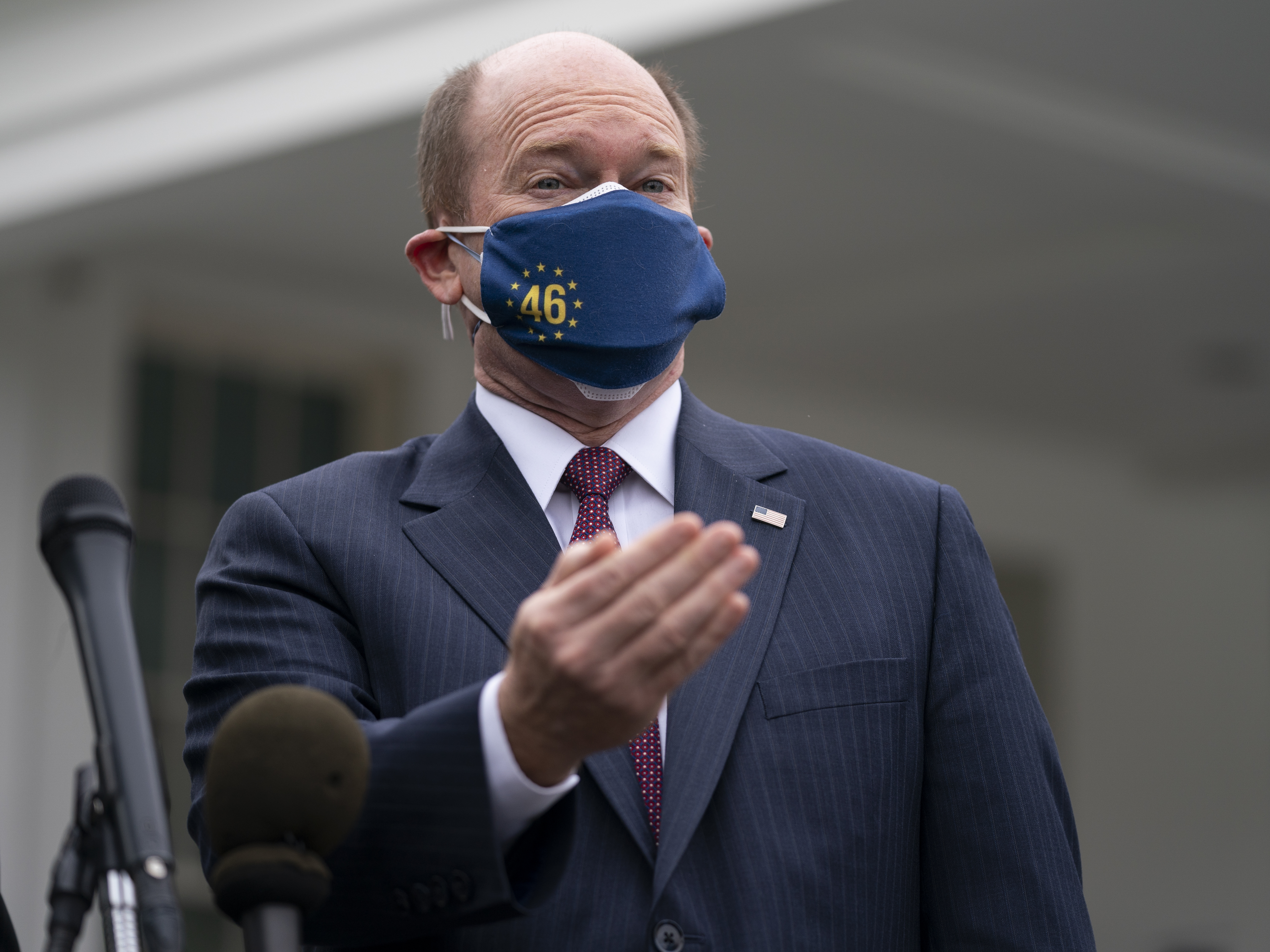 Delaware Democratic Sen. Chris Coons talks to reporters after meeting with President Joe Biden at the White House on Wednesday.