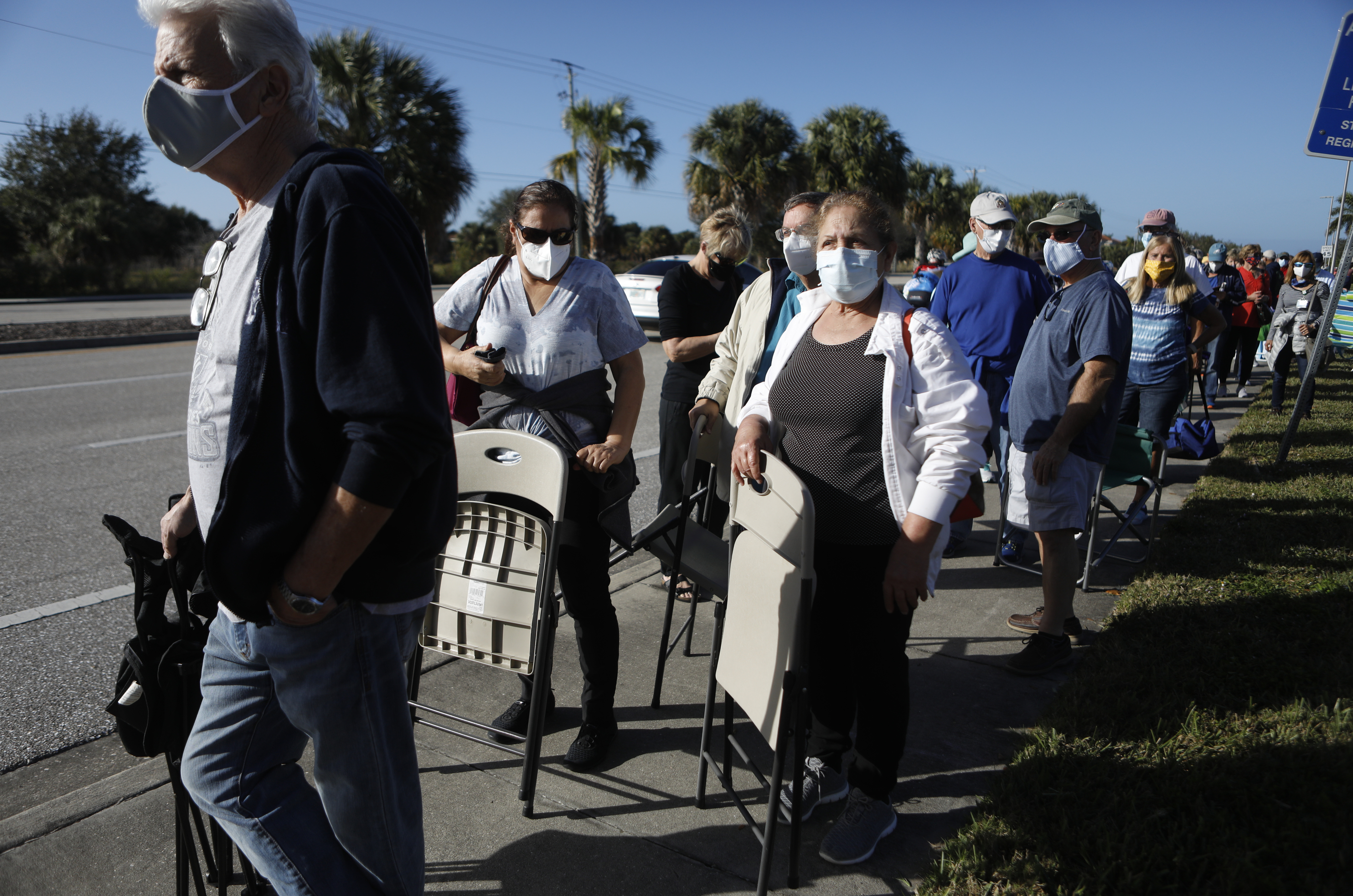 Seniors and first responders try to snag one of 800 doses available at a vaccination site in Fort Myers, Fla. (Getty Images)
