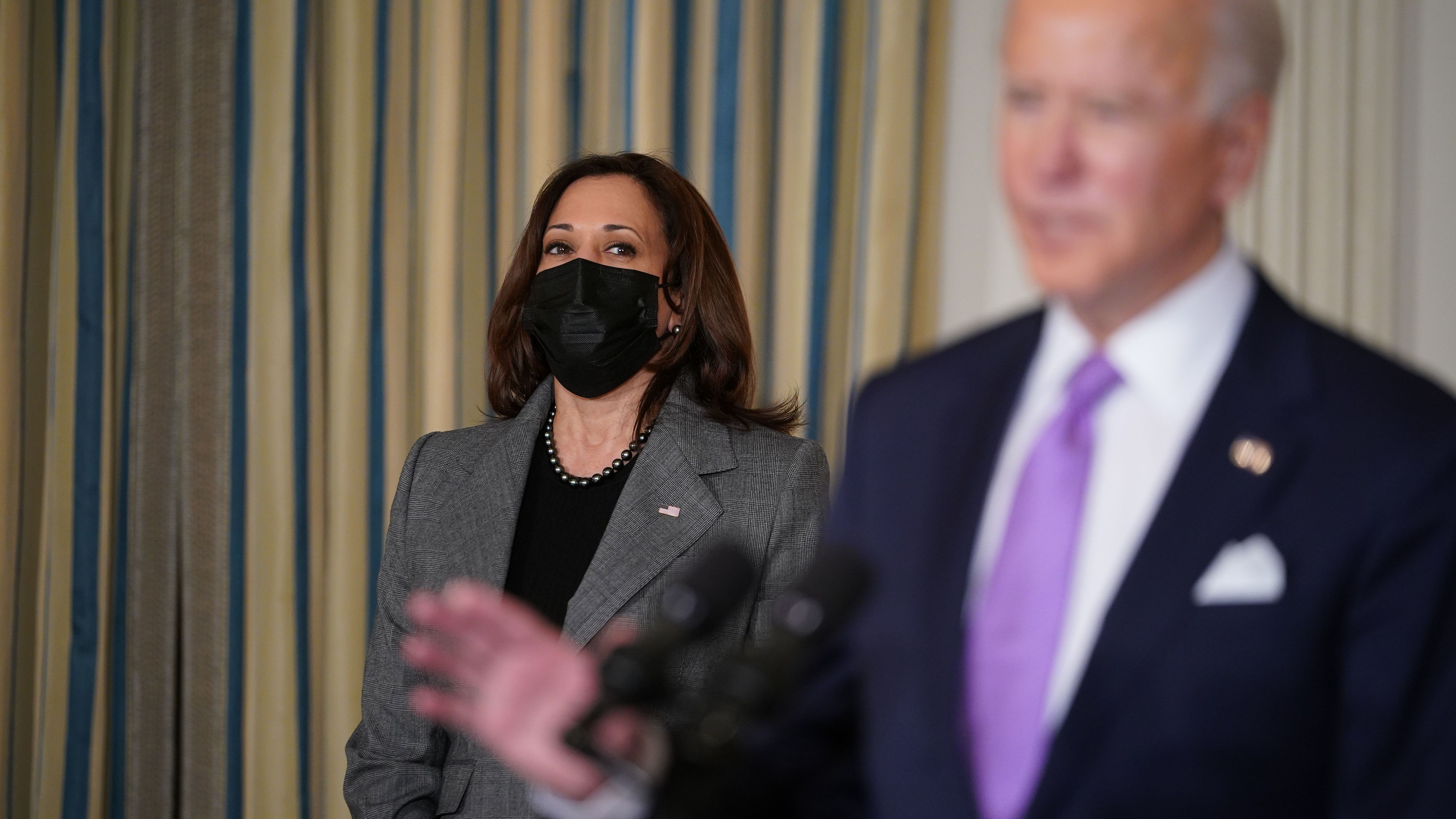 Vice President Harris listens as President Biden speaks on racial equity before signing executive orders at the White House on Jan. 26, part of a largely traditional public role she has played since taking office two weeks ago. (AFP via Getty Images)