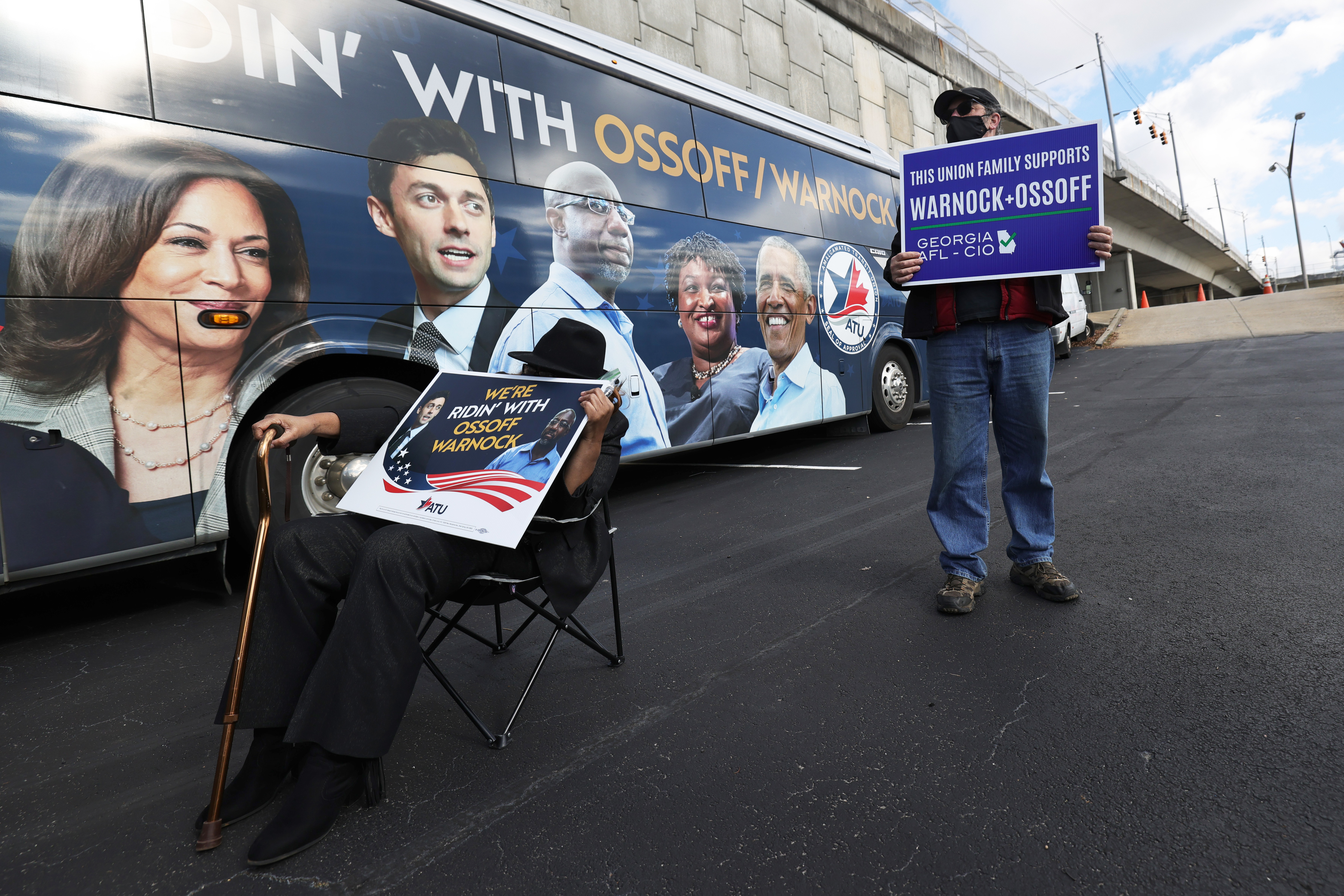 People listen to the Rev. Raphael Warnock speak on Jan. 5 in Marietta, Ga. Warnock and fellow Democrat Jon Ossoff won the Georgia Senate runoffs on the strength of superior Democratic organizing around the state. (Getty Images)