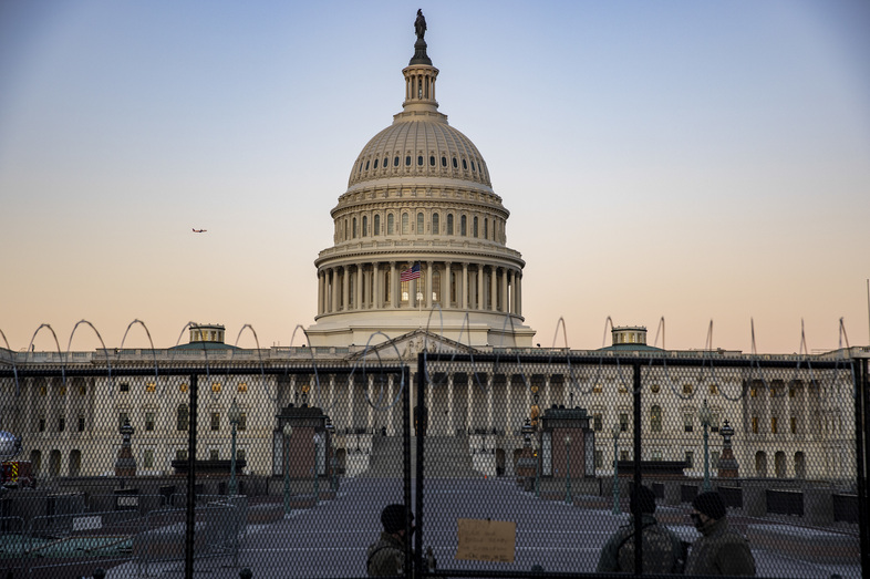 National Guard troops and Capitol Police stand guard at the U.S. Capitol on Monday, the day before Donald Trump's second Senate impeachment trial is set to begin. (Tasos Katopodis/Getty Images)
