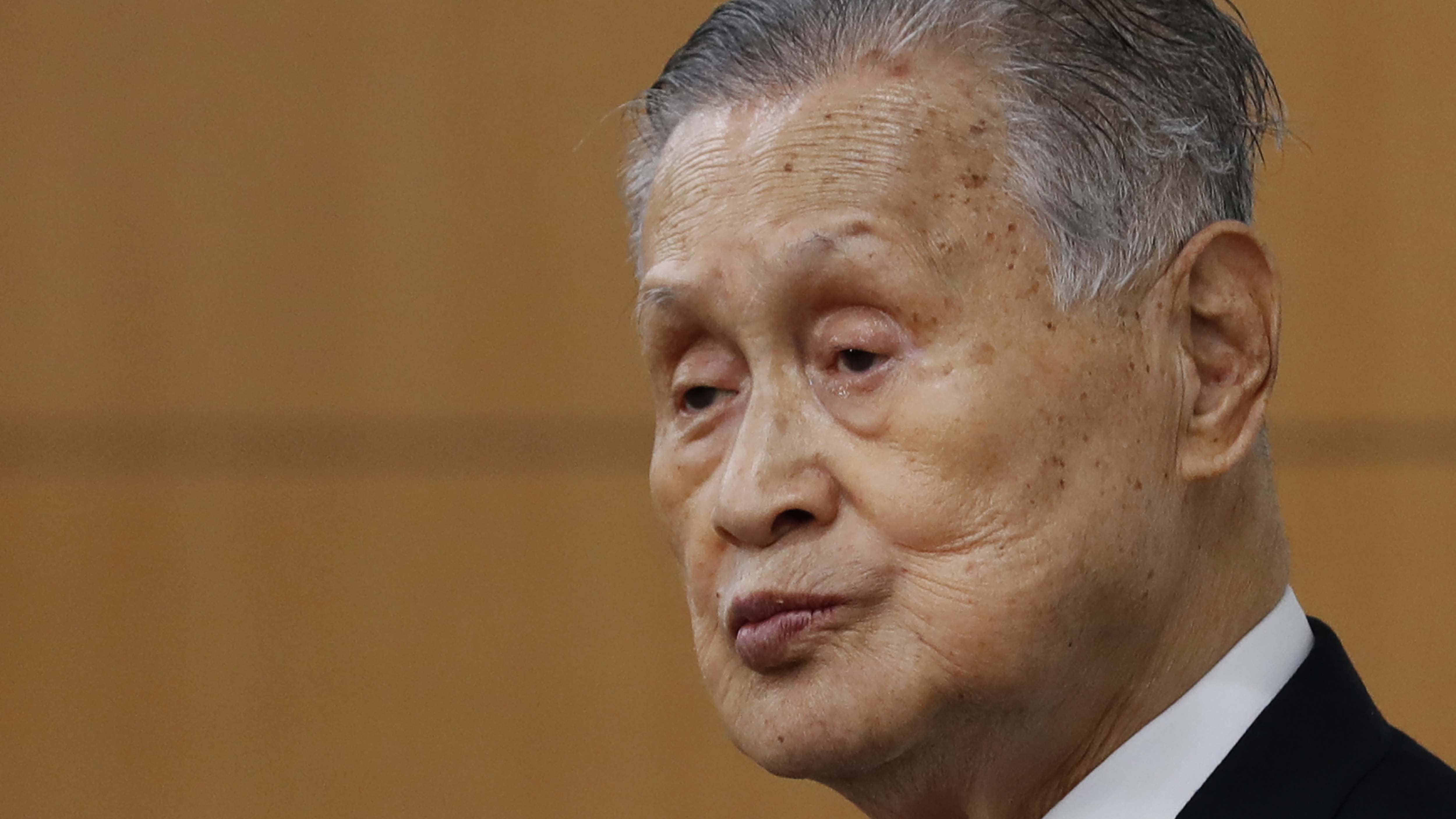 Yoshiro Mori, the president of the Tokyo Olympic organizing committee, listens to a question from a journalist during a news conference in Tokyo last Thursday.