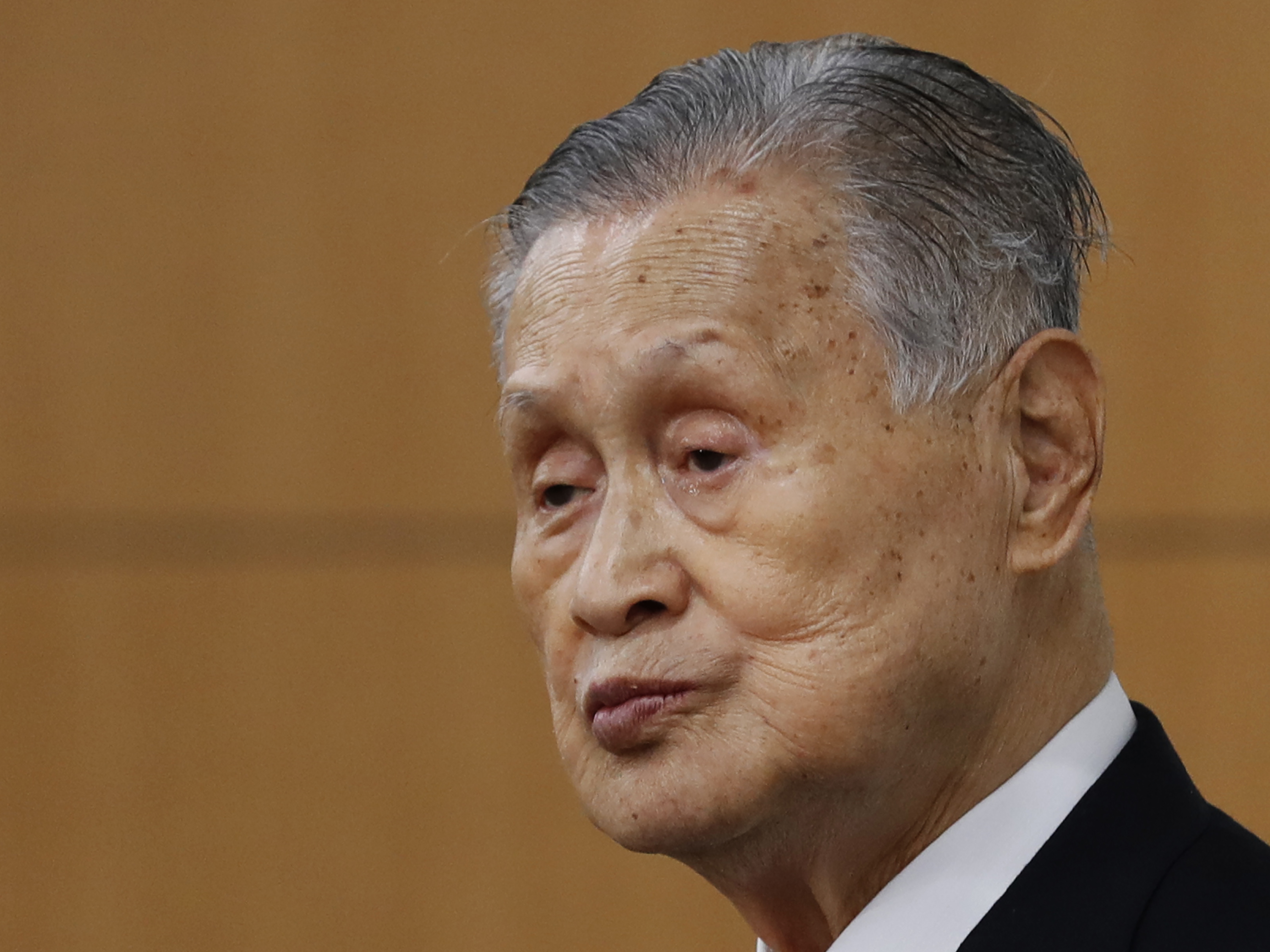 Yoshiro Mori, the president of the Tokyo Olympic organizing committee, listens to a question from a journalist during a news conference in Tokyo last week.