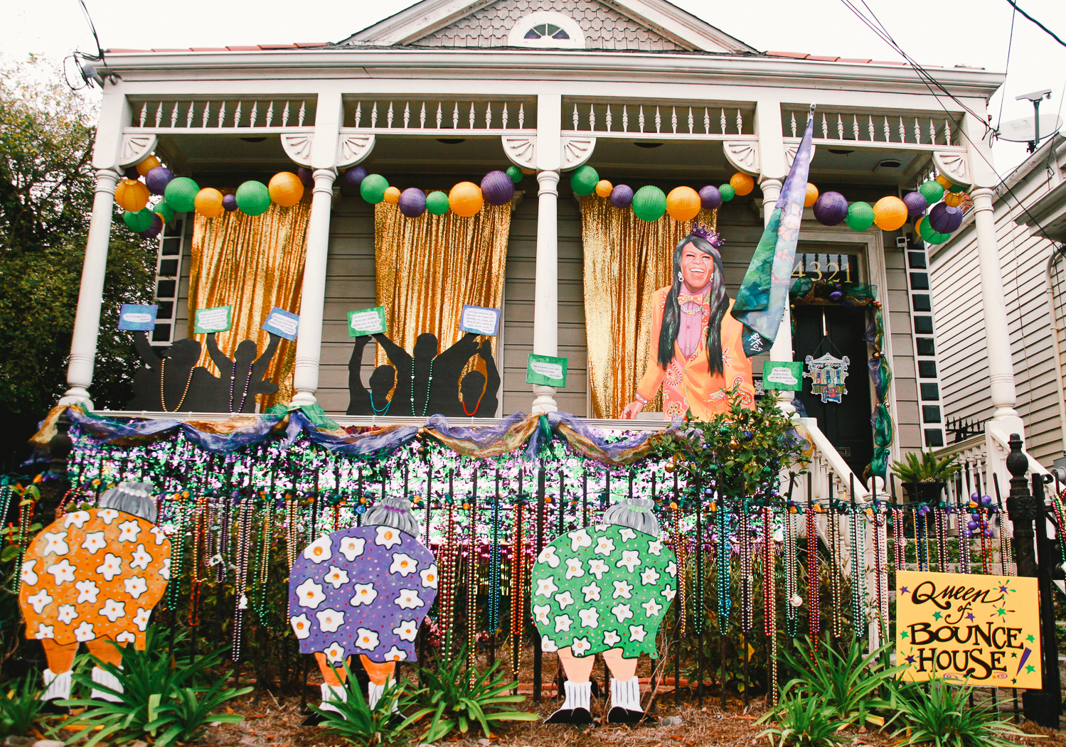 Across New Orleans, thousands of homes like this one — the &quot;Queen of Bounce House&quot; — are decorated for Mardi Gras. People drive from house-to-house because the city canceled parades due to COVID. (WWNO)