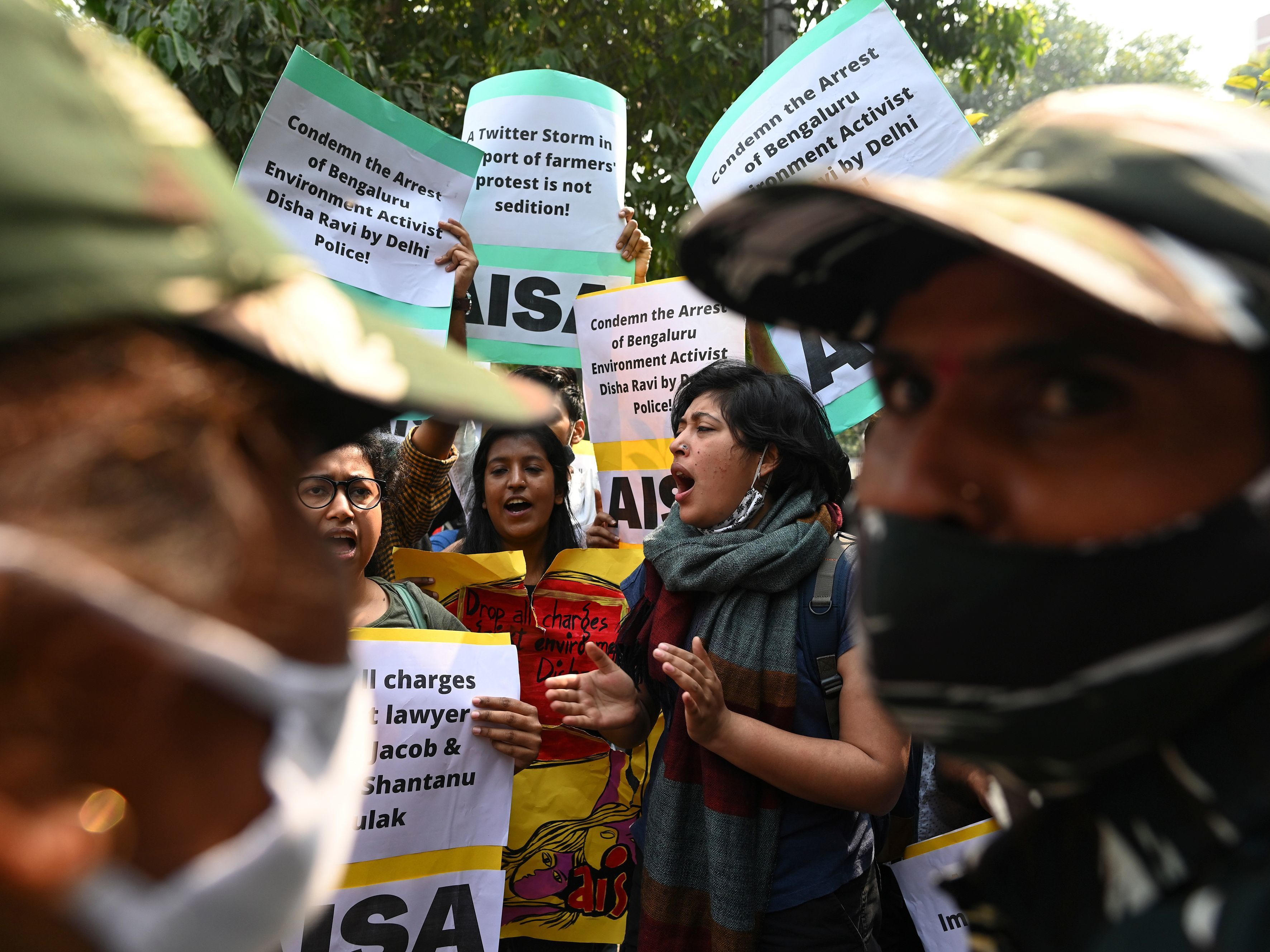 Demonstrators in New Delhi shout slogans during a protest against the arrest of climate change activist Disha Ravi for allegedly helping to create a guide for anti-government farmers protests. (AFP via Getty Images)