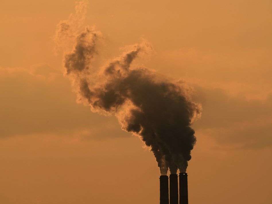 Smokestacks at the Jeffrey Energy Center coal-fired power plant are silhouetted against the sky at sunset in September near Emmet, Kan. (Charlie Riedel/AP)