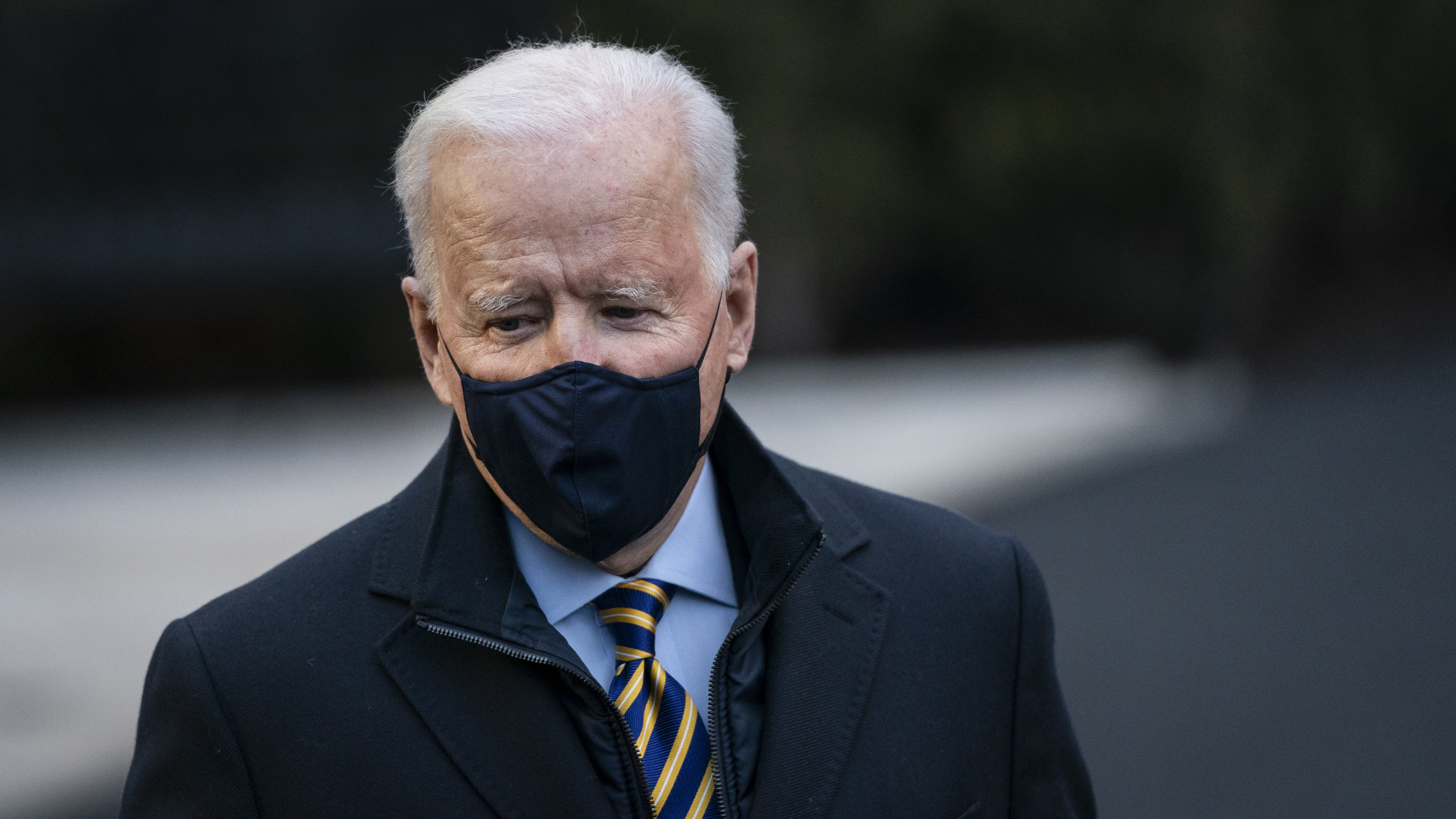 President Biden, pictured at the White House on Feb. 16, is giving an address Monday night to honor those who have died from COVID-19.