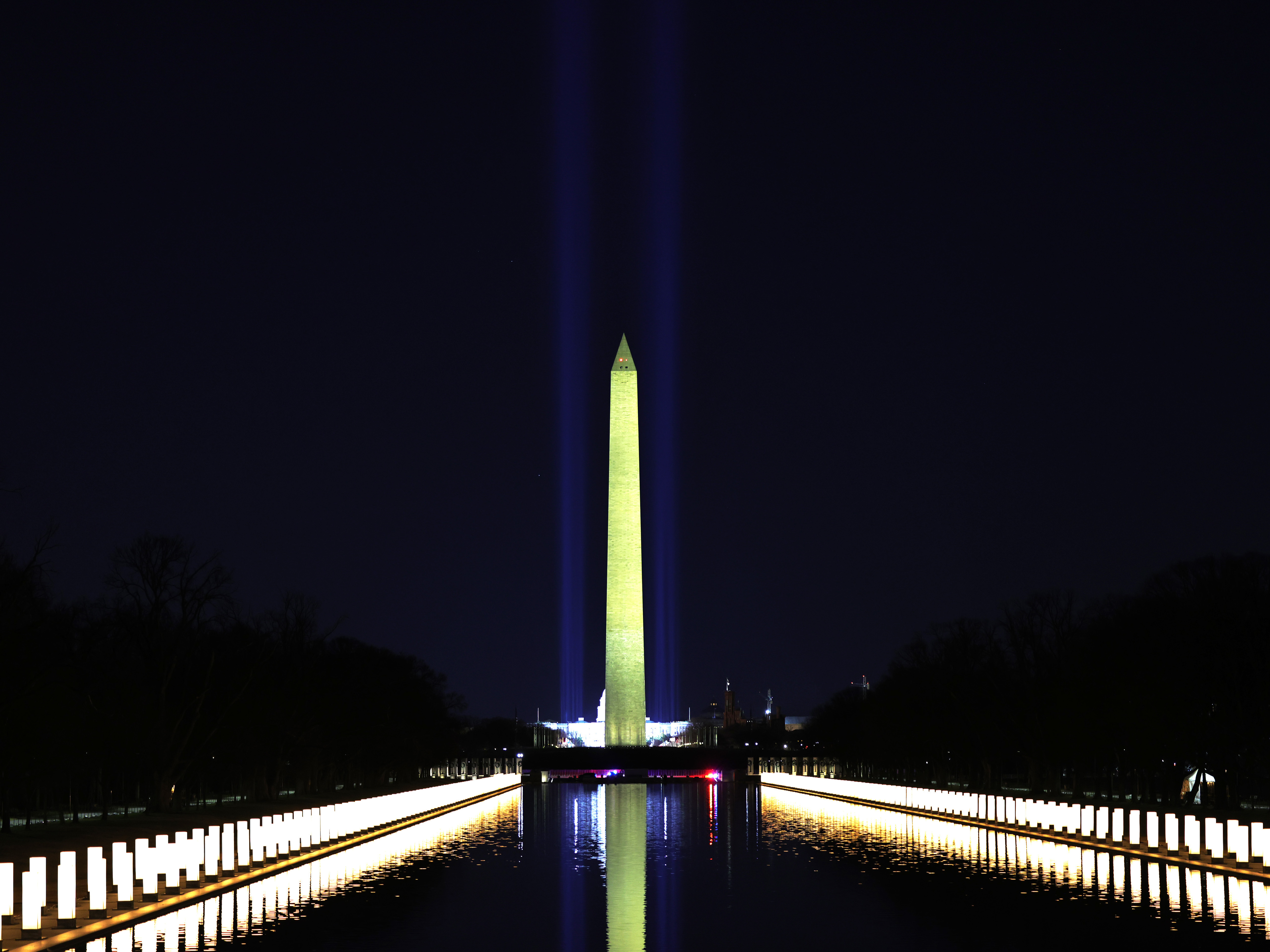 Columns along the sides of the Lincoln Memorial Reflecting Pool pay tribute to victims of COVID-19 at a Jan. 19 memorial. Just over a month later, a Monday evening ceremony will pay tribute to 500,000 Americans lives lost. (Getty Images)