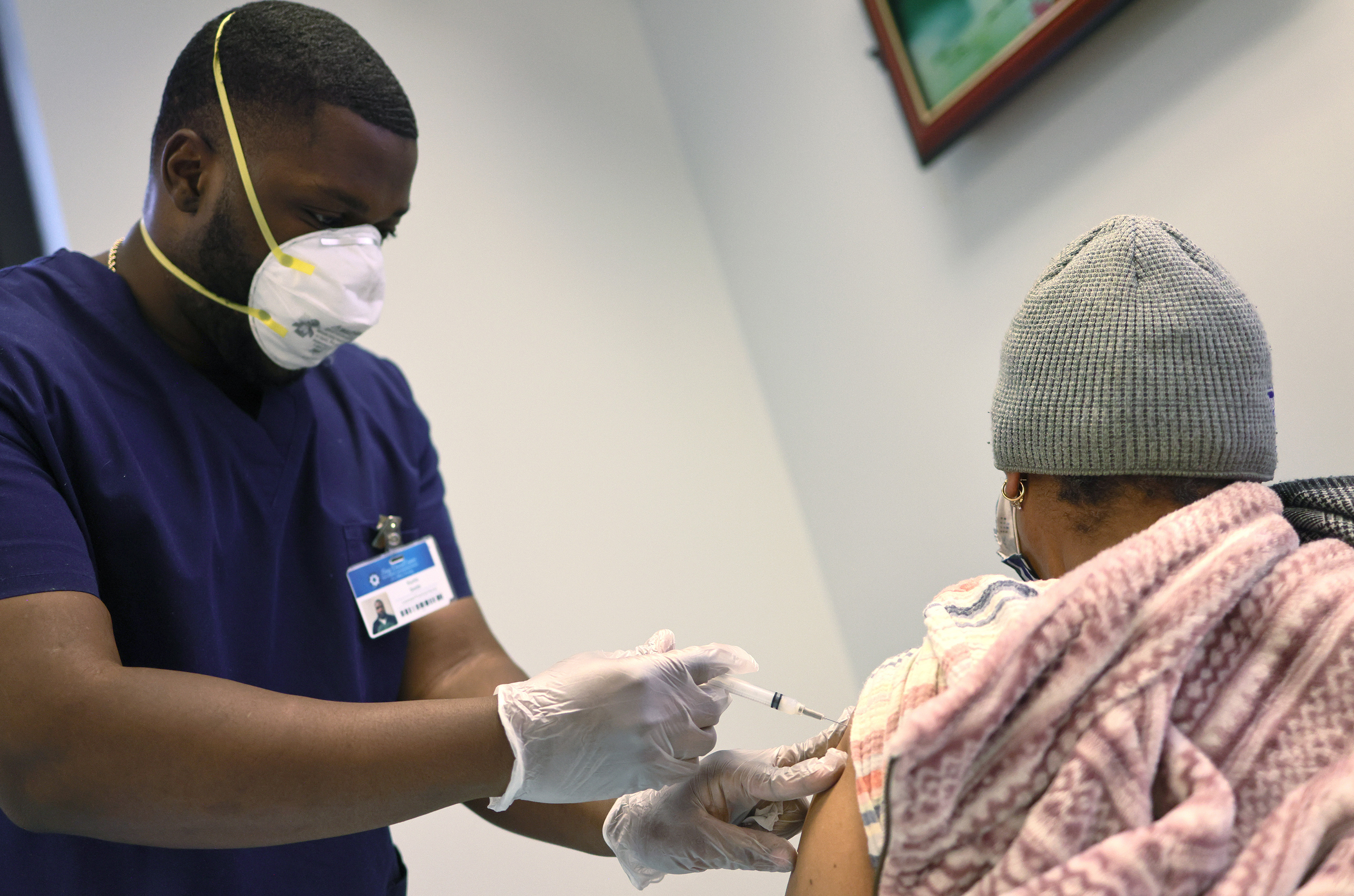 Kurtis Smith gives the Moderna coronavirus vaccine to a resident at Red Hook Neighborhood Senior Center in Brooklyn, N.Y., on Monday. (Getty Images)