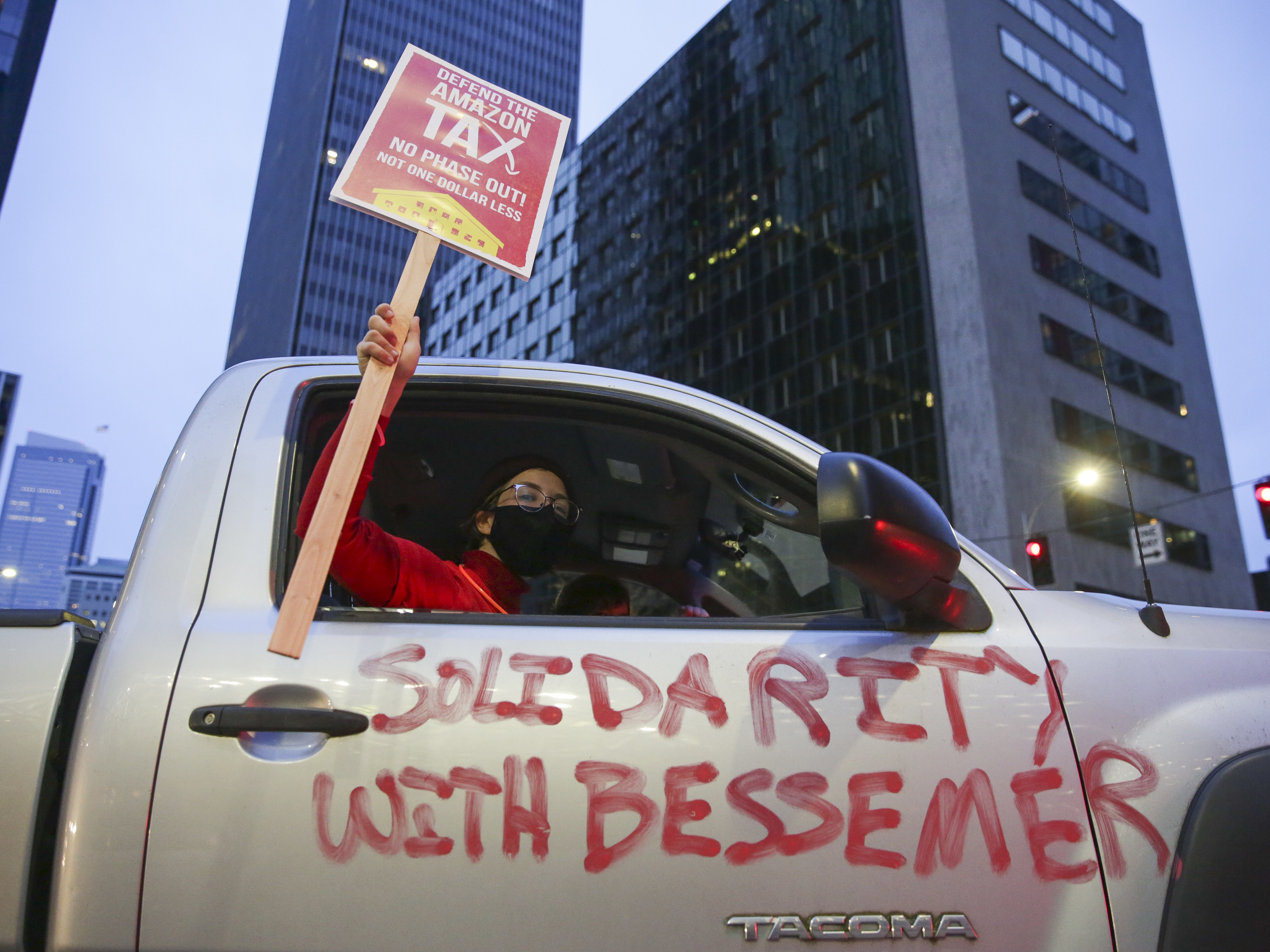 More than 5,800 warehouse workers at the Bessemer, Ala., Amazon facility are voting this month on whether to join the Retail, Wholesale and Department Store Union. Supporters are protesting in solidarity with those workers. (AFP via Getty Images)