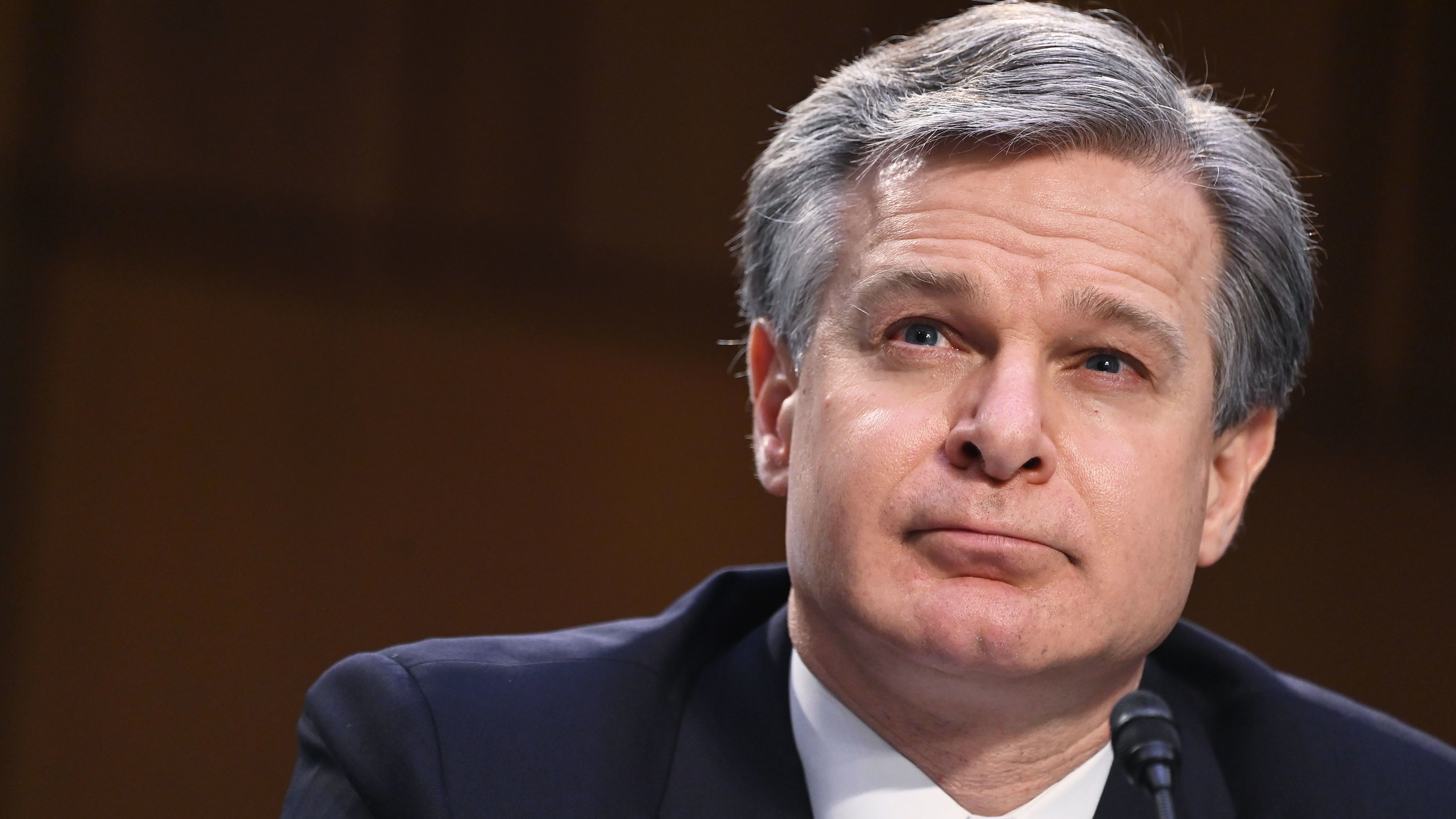 FBI Director Christopher Wray testifies on Tuesday before the Senate Judiciary Committee about the Jan. 6 insurrection at the Capitol. (AFP via Getty Images)