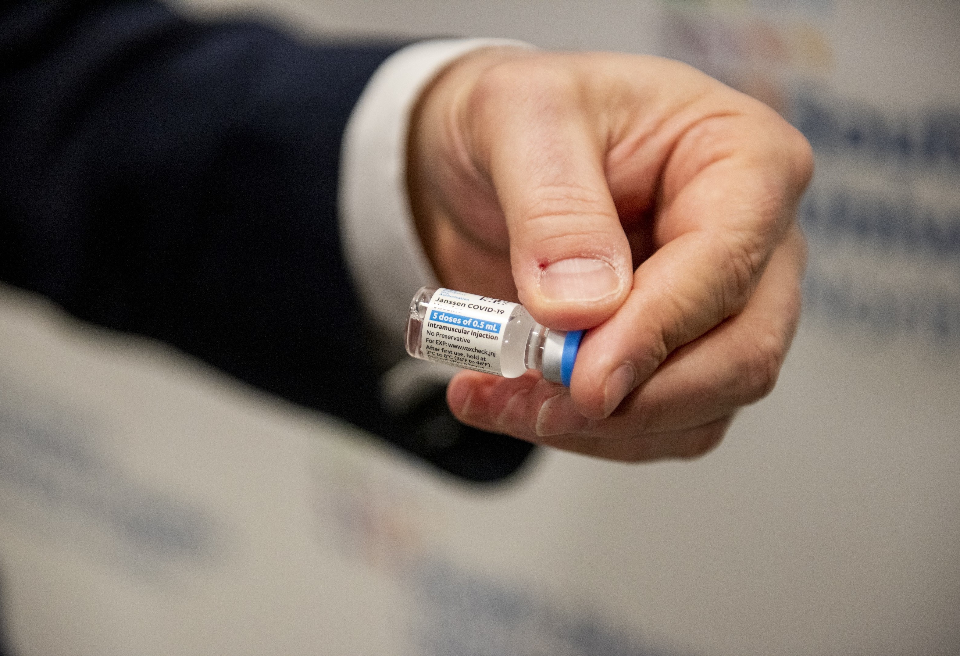A health care worker holds a vial of the Johnson & Johnson COVID-19 vaccine at South Shore University Hospital in Bay Shore, N.Y., on Wednesday. (Bloomberg via Getty Images)