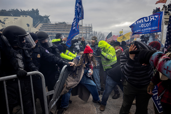 Trump supporters clash with police outside the U.S. Capitol on Jan. 6. Social media companies are under scrutiny for allowing their platforms to be used to spread falsehoods about the 2020 election and to allow violent extremist groups to organize January's insurrection.