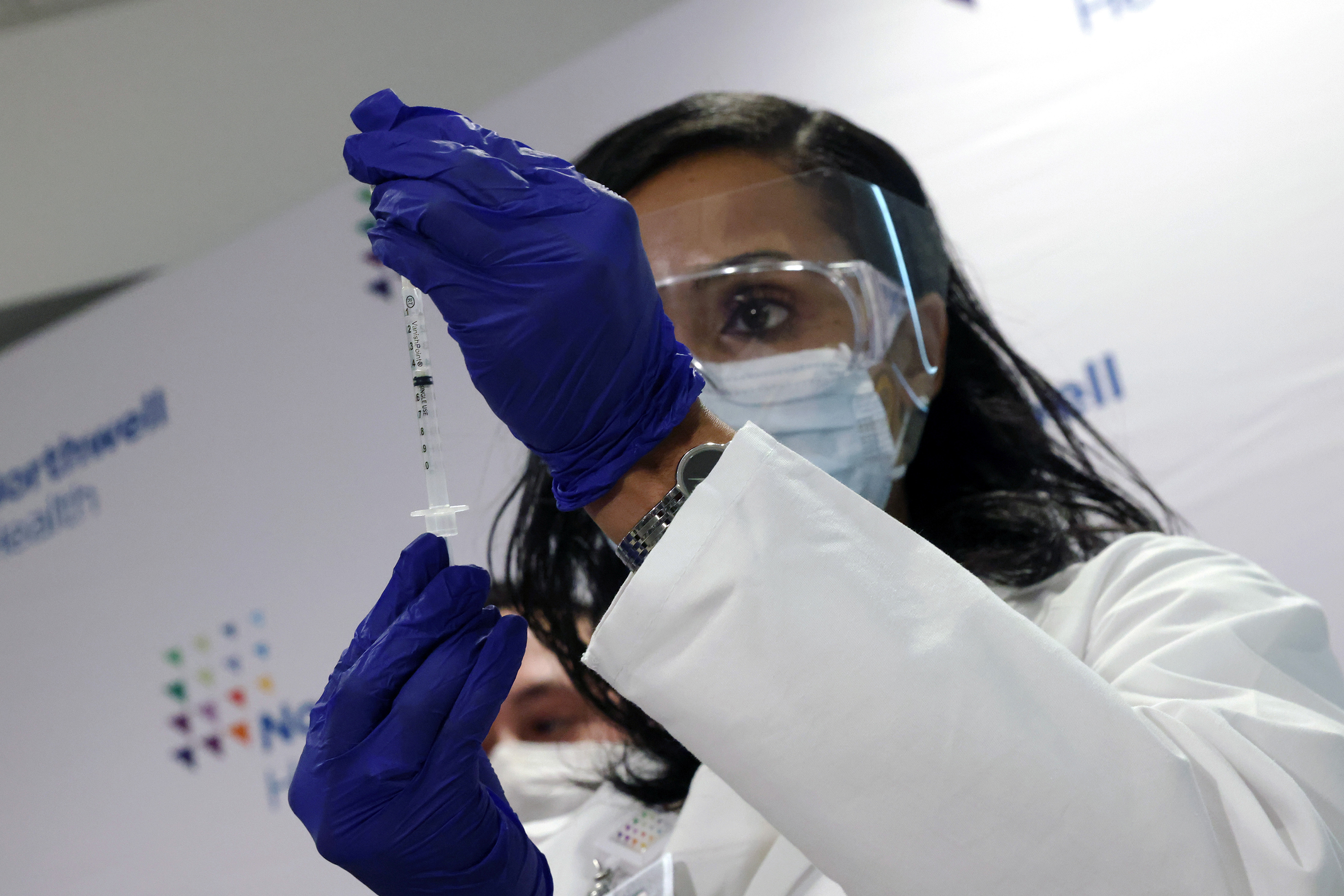 A medical worker at South Shore University Hospital gets ready to administer the newly available Johnson & Johnson COVID-19 vaccine in Bay Shore, N.Y., Wednesday. Clinical research found it to be 85% effective in preventing severe disease four weeks after vaccination, and it has demonstrated promising indications of protection against a couple of concerning variants of the coronavirus. (Getty Images)