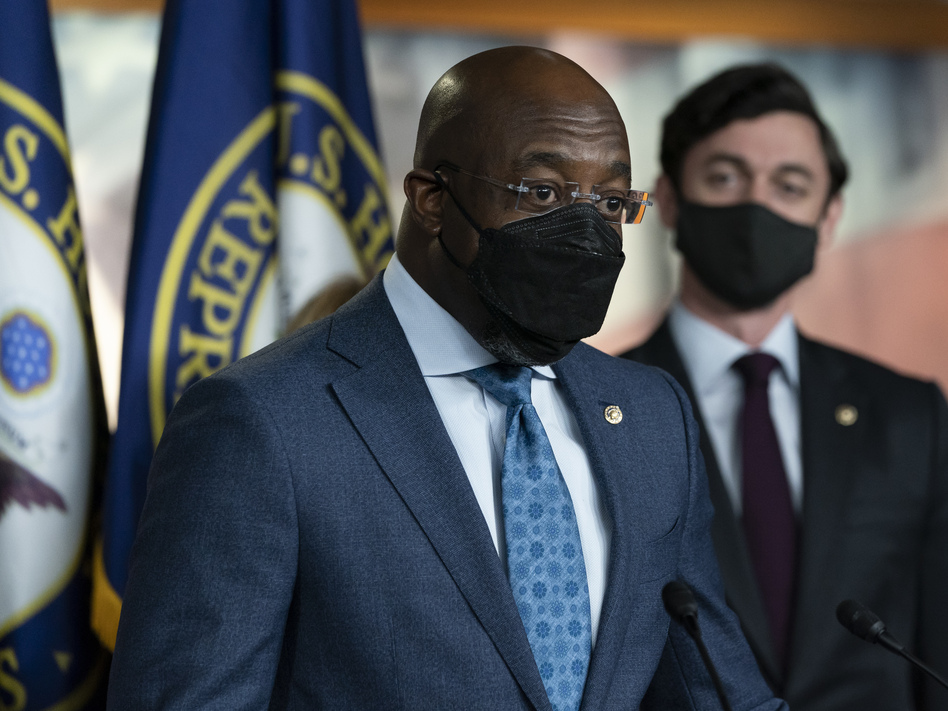 Sen. Raphael Warnock, D-Ga., left, accompanied by Sen. Jon Ossoff, D-Ga., speaks during a news conference, before the vote on the Democrat's $1.9 trillion COVID-19 relief bill on March 10, 2021. (Alex Brandon/AP)