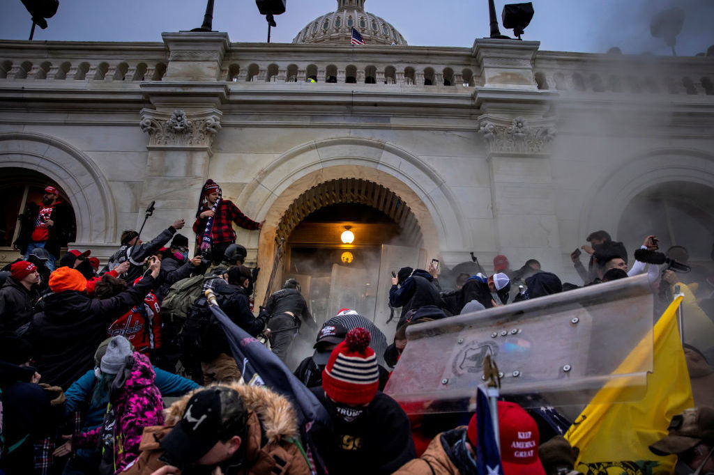 Pro-Trump rioters clash with police and security forces as people storm the U.S. Capitol on Jan. 6. Federal investigators say they expect even more people will be charged in connection with the insurrection. (Getty Images)