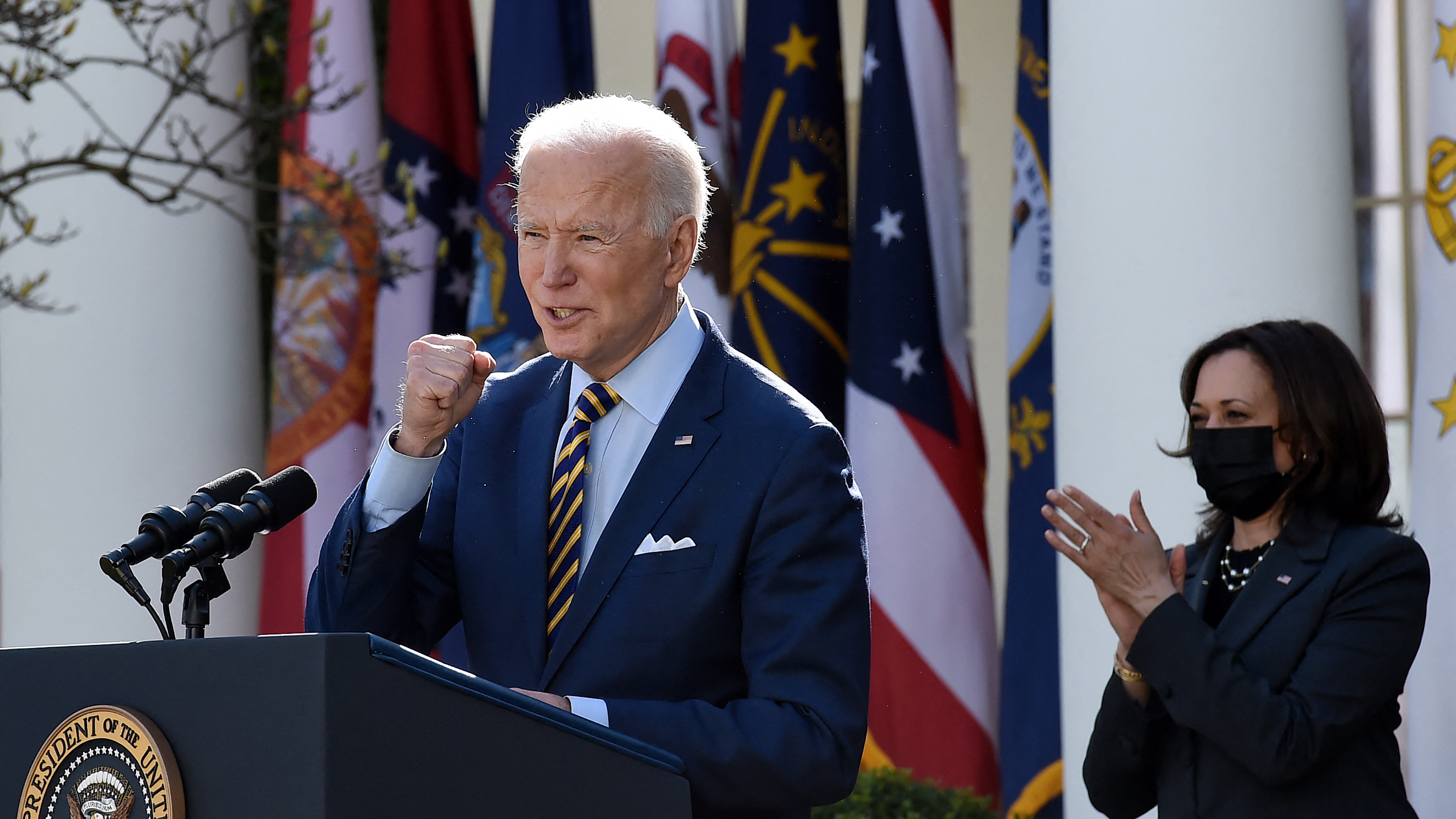 President Biden, with Vice President Harris behind him, speaks about the American Rescue Plan in the Rose Garden of the White House on Friday. (AFP via Getty Images)