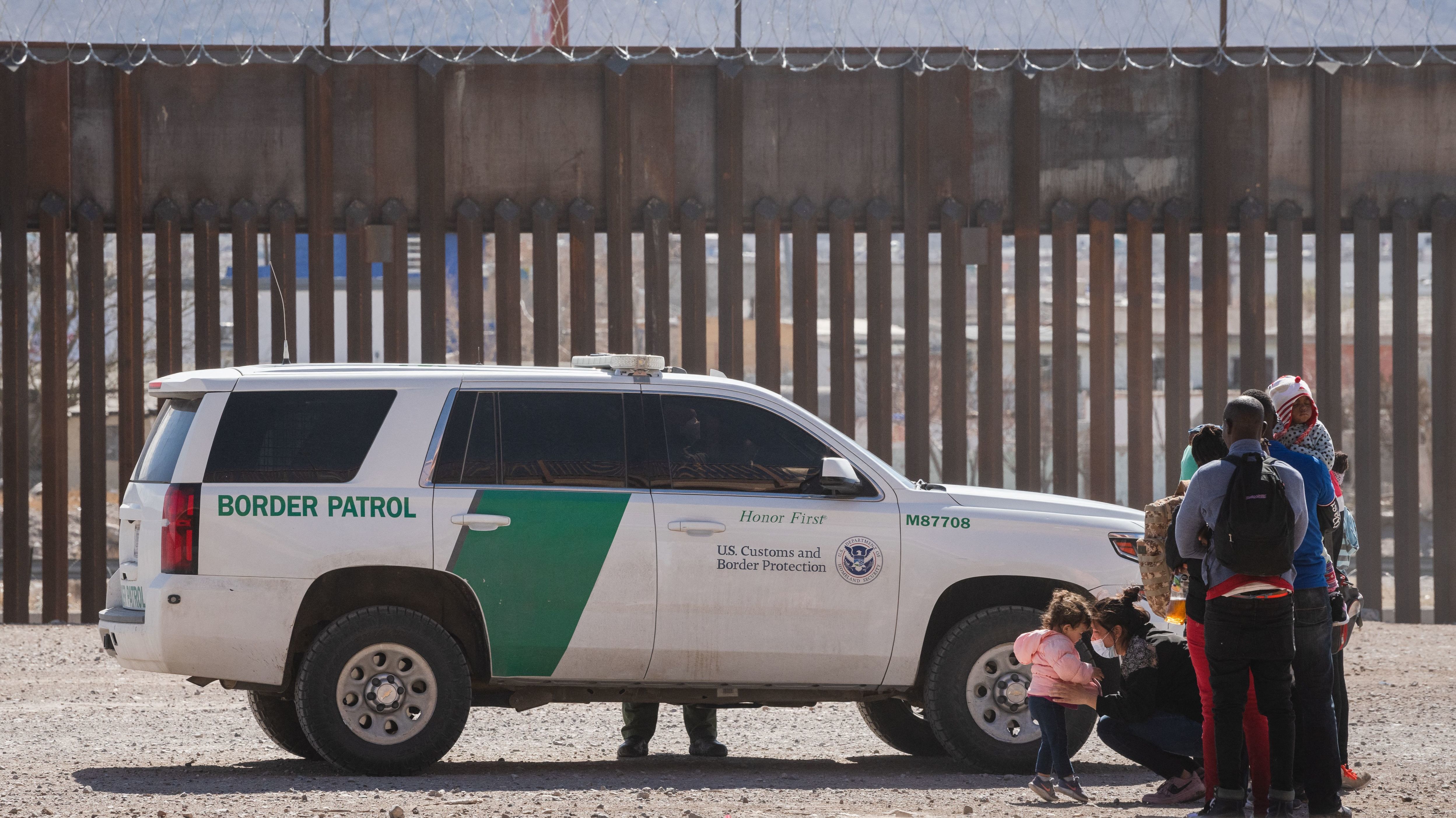Border Patrol agents apprehend a group of migrants near downtown El Paso, Texas, on Monday. The Department of Homeland Security is struggling to manage a growing number of unaccompanied minors at the border. (AFP via Getty Images)