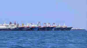 Philippines Calls On China To Remove Massive Fishing Fleet At Disputed Reef