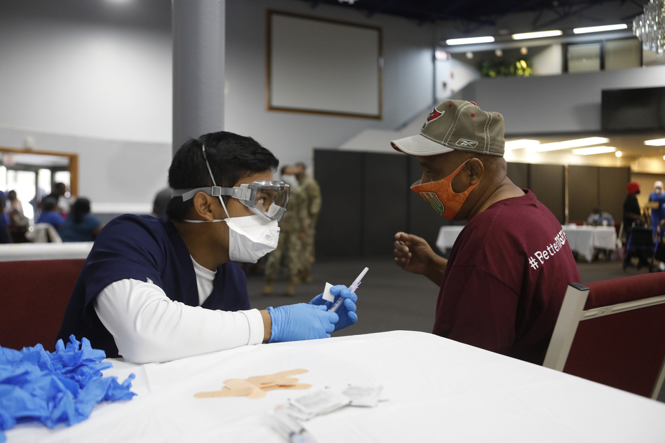 Florida's Pasco County Health Department and the Army National Guard partnered with Fellowship Church in Tampa, Fla., to help city residents age 65 and older get immunized with the Moderna COVID-19 vaccine in February. (Octavio Jones/Getty Images)