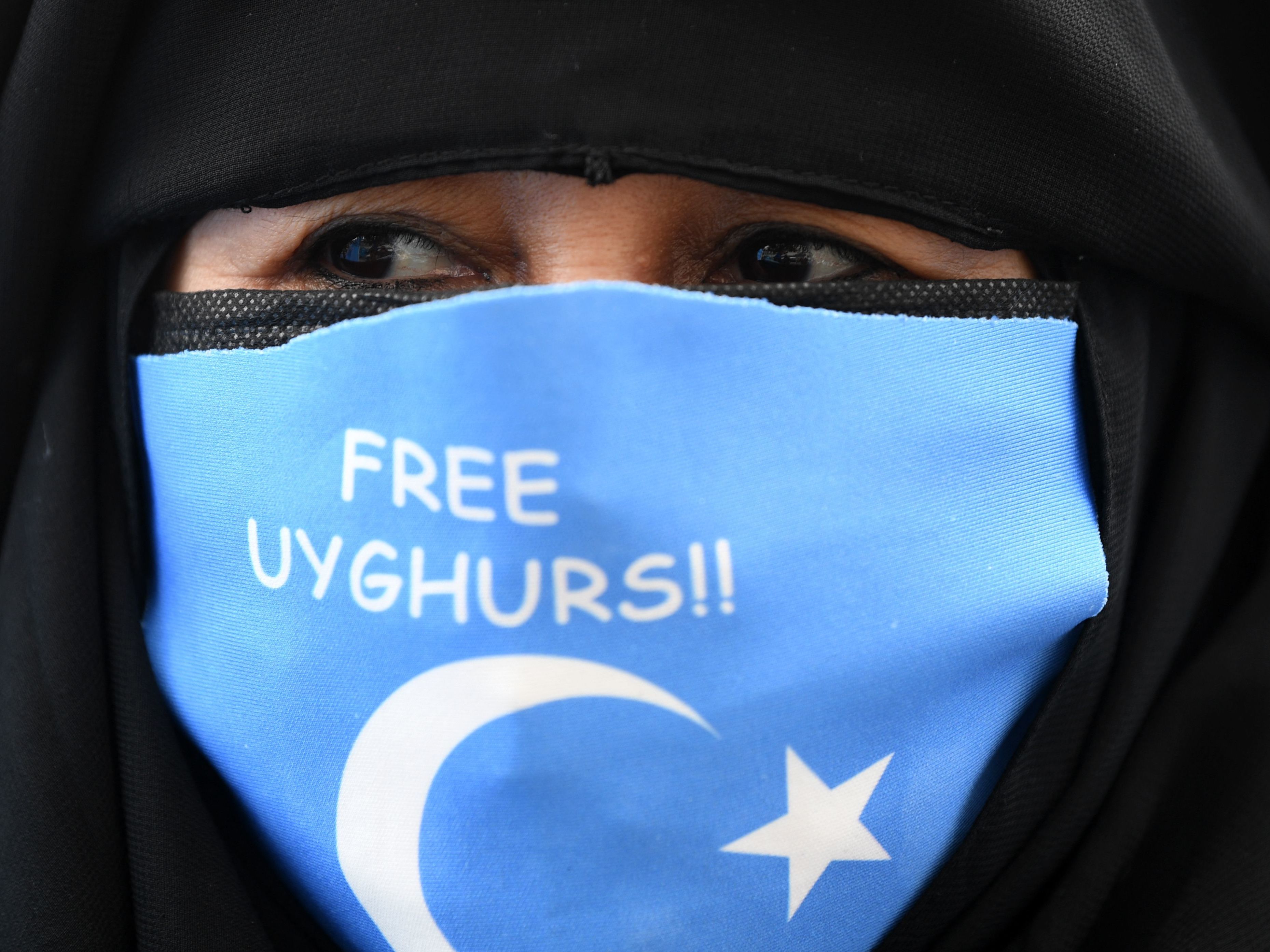 A protester near China's consulate in Istanbul on March 8. (AFP via Getty Images)