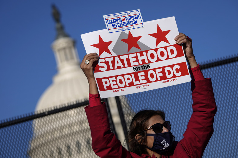 Residents of the District of Columbia rally for statehood Monday near the U.S. Capitol ahead of a House committee hearing on the effort. (Drew Angerer/Getty Images)