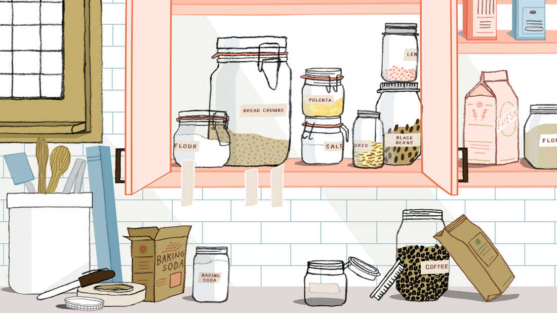Illustration of section of kitchen counter and cabinet space in the process of being organized. The cabinets are filled with labeled glass jars containing dry goods. Torn pieces of of masking tape hang from the cabinet. The counter is scattered with ingredients and a roll of masking tape and a permanent marker used for making labels for glass jars of ingredients.