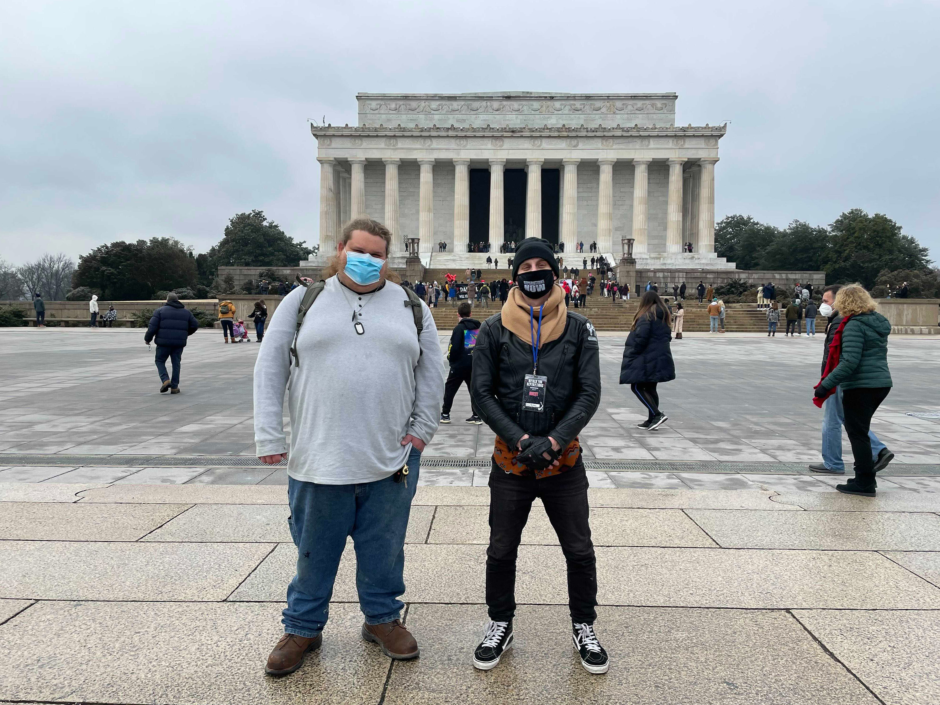 Distant cousins Cody (left) and Andrew meet in Washington, D.C. Cody is a member of a Three Percenter-affiliated militia group, and Andrew is an organizer with Black Lives Matter activists. The two connected on Facebook and have gotten to know each other while researching their ancestry. (NPR)