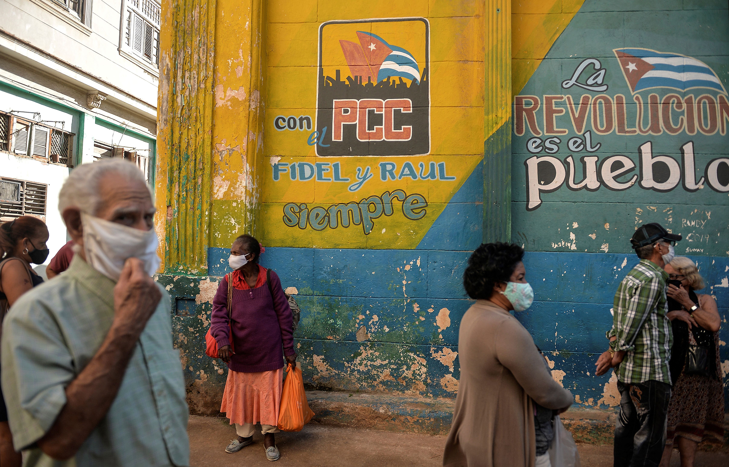 Cubans line up to buy food in Havana on March 3. The island nation is working to develop a vaccine against COVID-19. If successful, the island nation hopes to produce 1 to 2 million doses a month. (AFP via Getty Images)