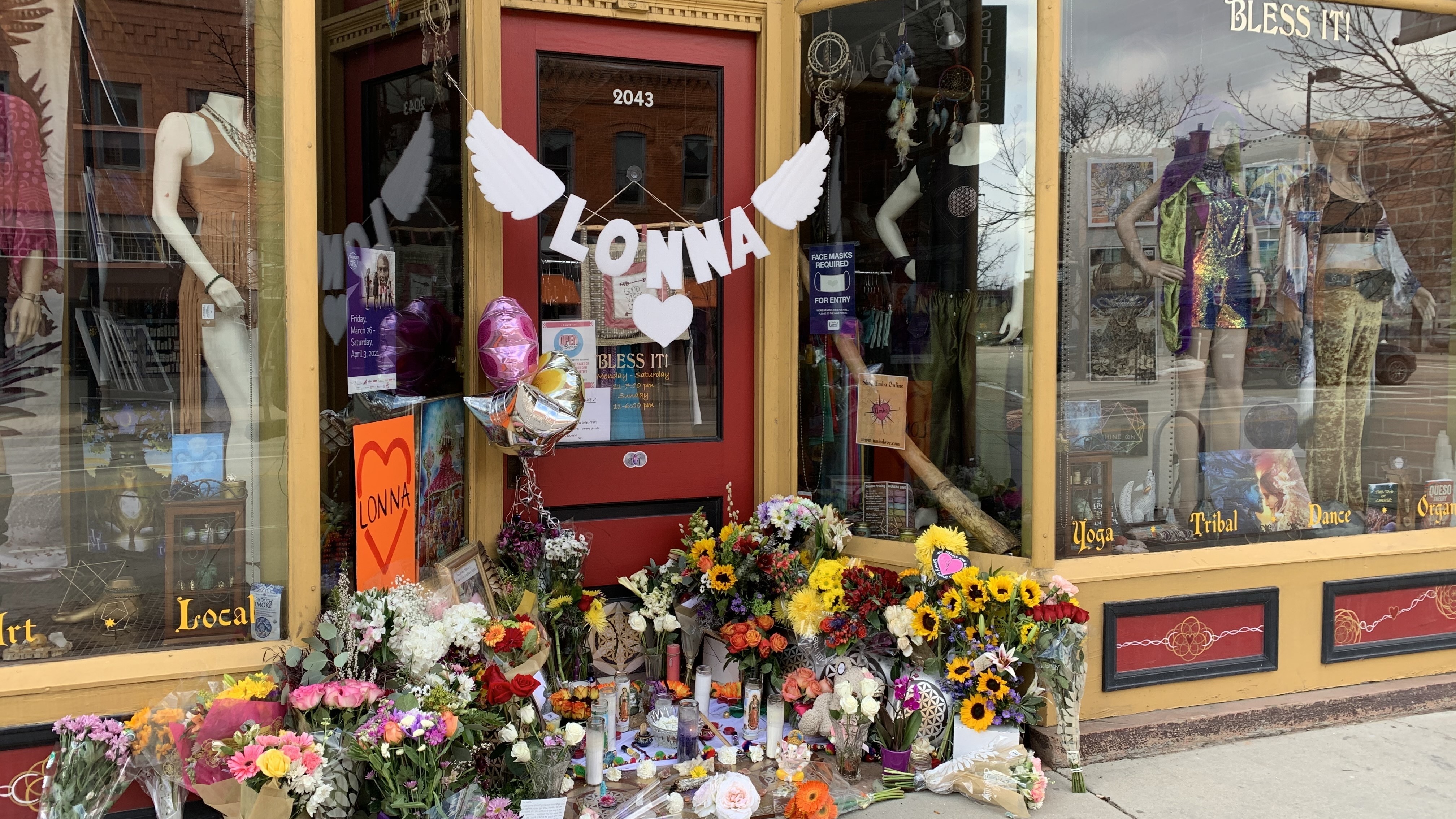 A makeshift memorial in front of a downtown Boulder store that shooting victims Tralona Bartkowiak co-owned with her sister. (Kirk Siegler /NPR)