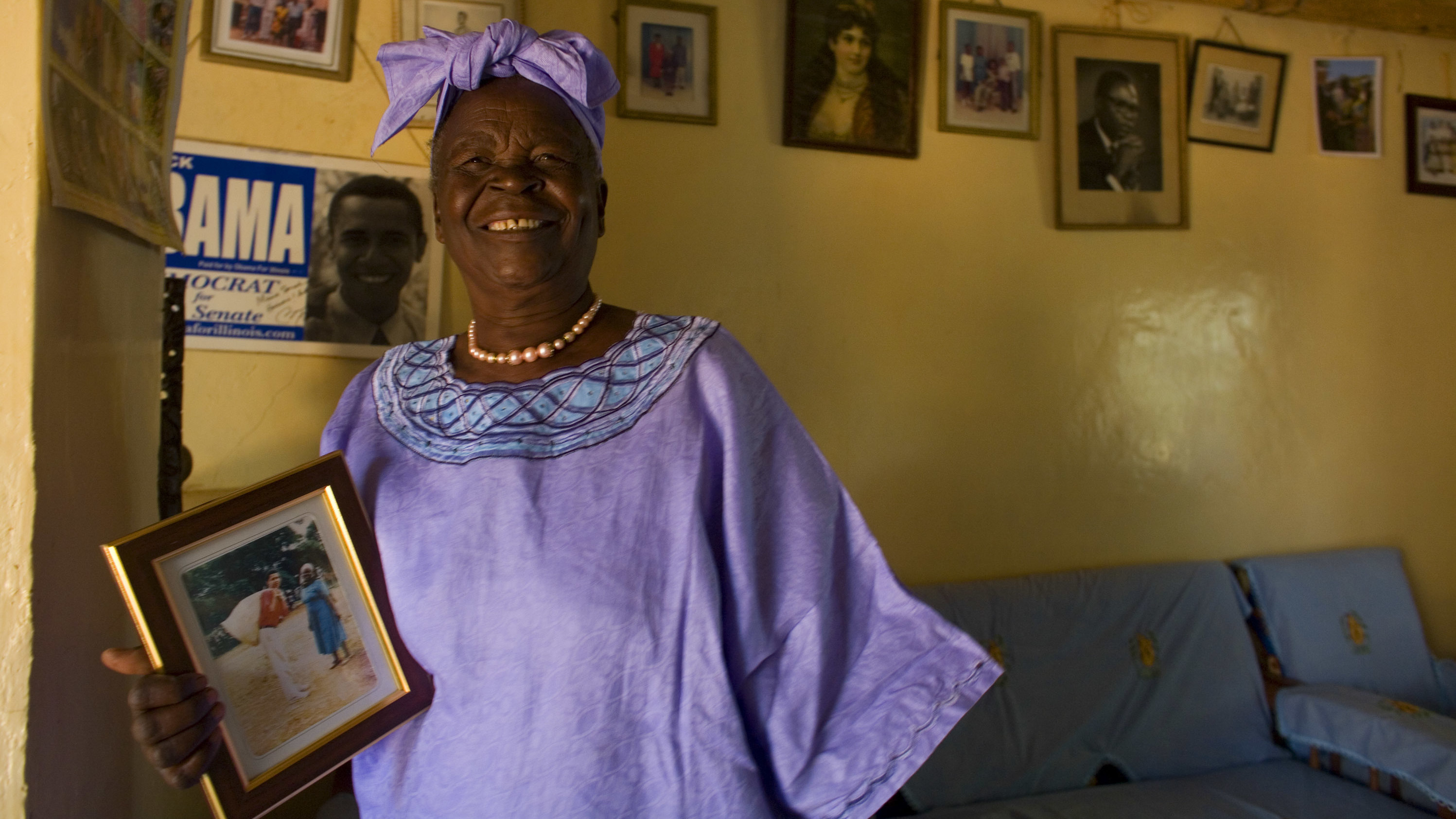 Sarah Obama holds a photograph of her grandson, Barack Obama in Kogelo, Kenya while awaiting the results of Super Tuesday's primary in Feb. 2008. She died on Monday after a brief illness, and is being remembered as a beloved matriarch and philanthropist.