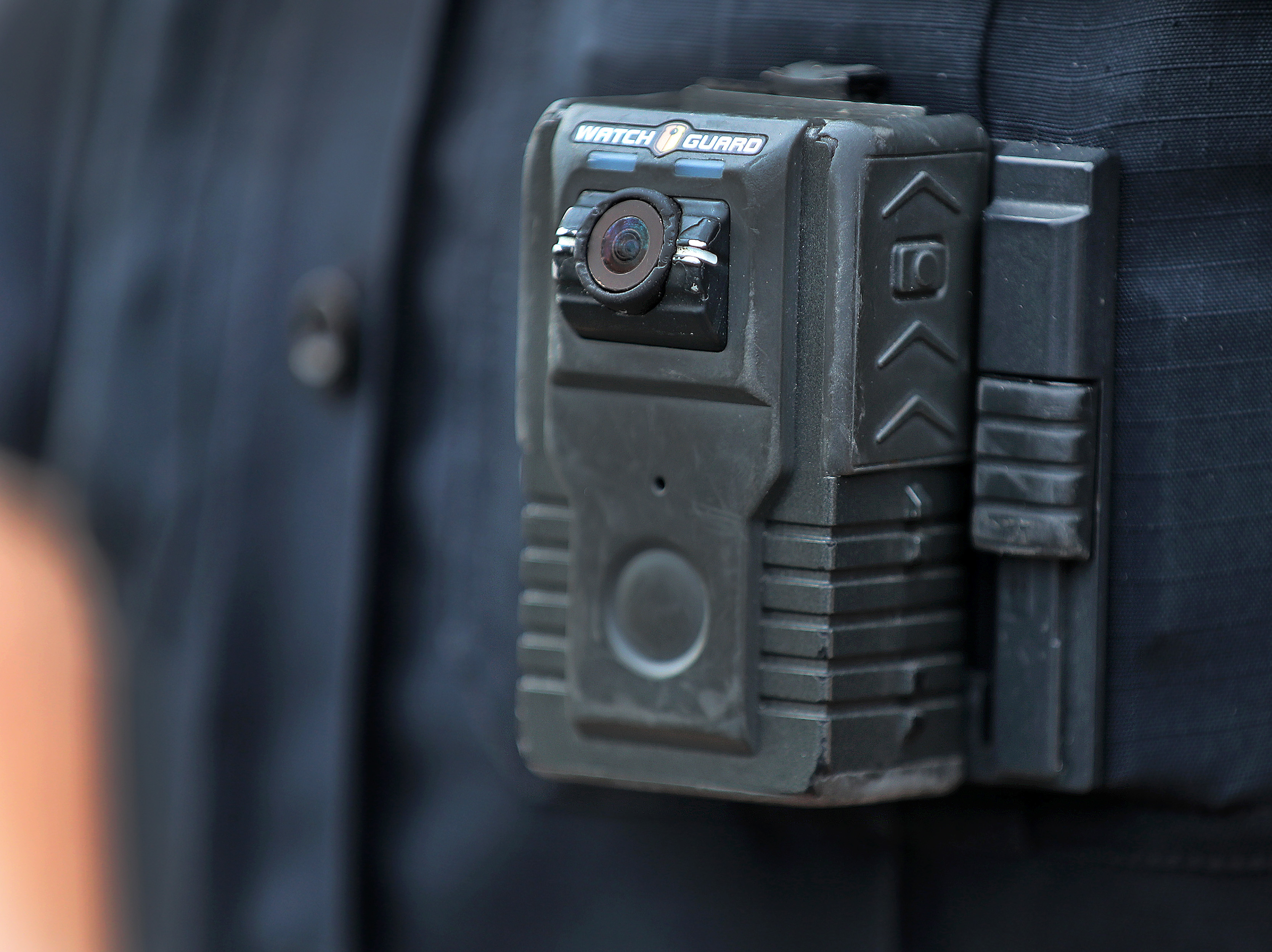 Police officer David Moore is pictured wearing a body camera in Ipswich, Mass., on Dec. 1, 2020. The city was among 25 statewide awarded grants to purchase body-worn cameras for videotaping interactions with the public. A new study says the benefits to society and police departments outweigh the costs of the cameras. (Boston Globe via Getty Images)