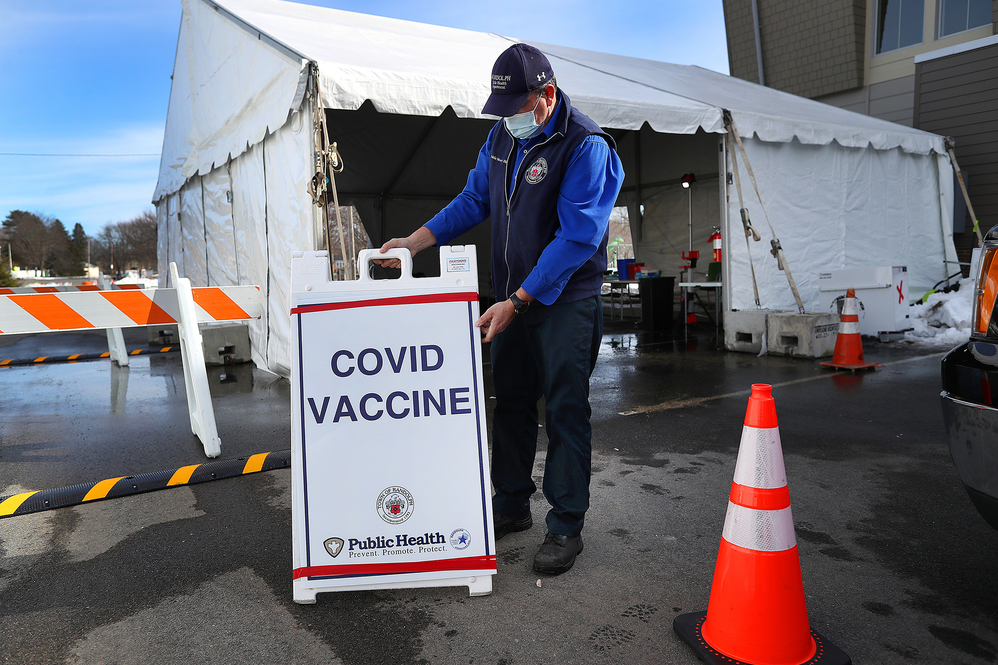 Nearly a third of adults in the U.S. have gotten at least one shot of the COVID-19 vaccine so far, but researchers warn that vaccine refusal may keep the country from reaching herd immunity. (The Boston Globe via Getty Images)