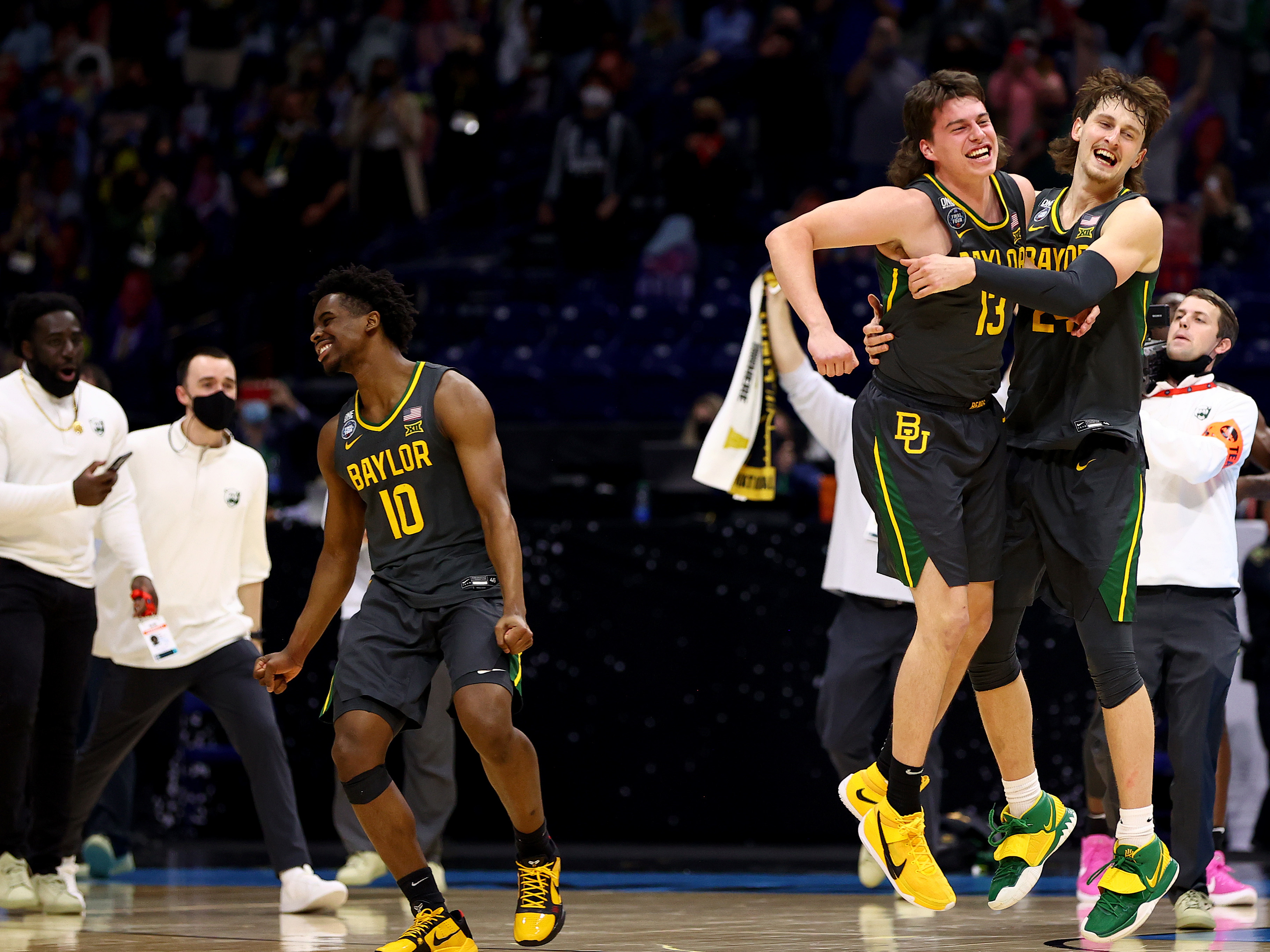 Baylor players (from left) Adam Flagler, Jackson Moffatt and Matthew Mayer celebrate after defeating the Gonzaga Bulldogs in the National Championship game of the 2021 NCAA Men's Basketball Tournament at Lucas Oil Stadium. (NCAA Photos via Getty Images)