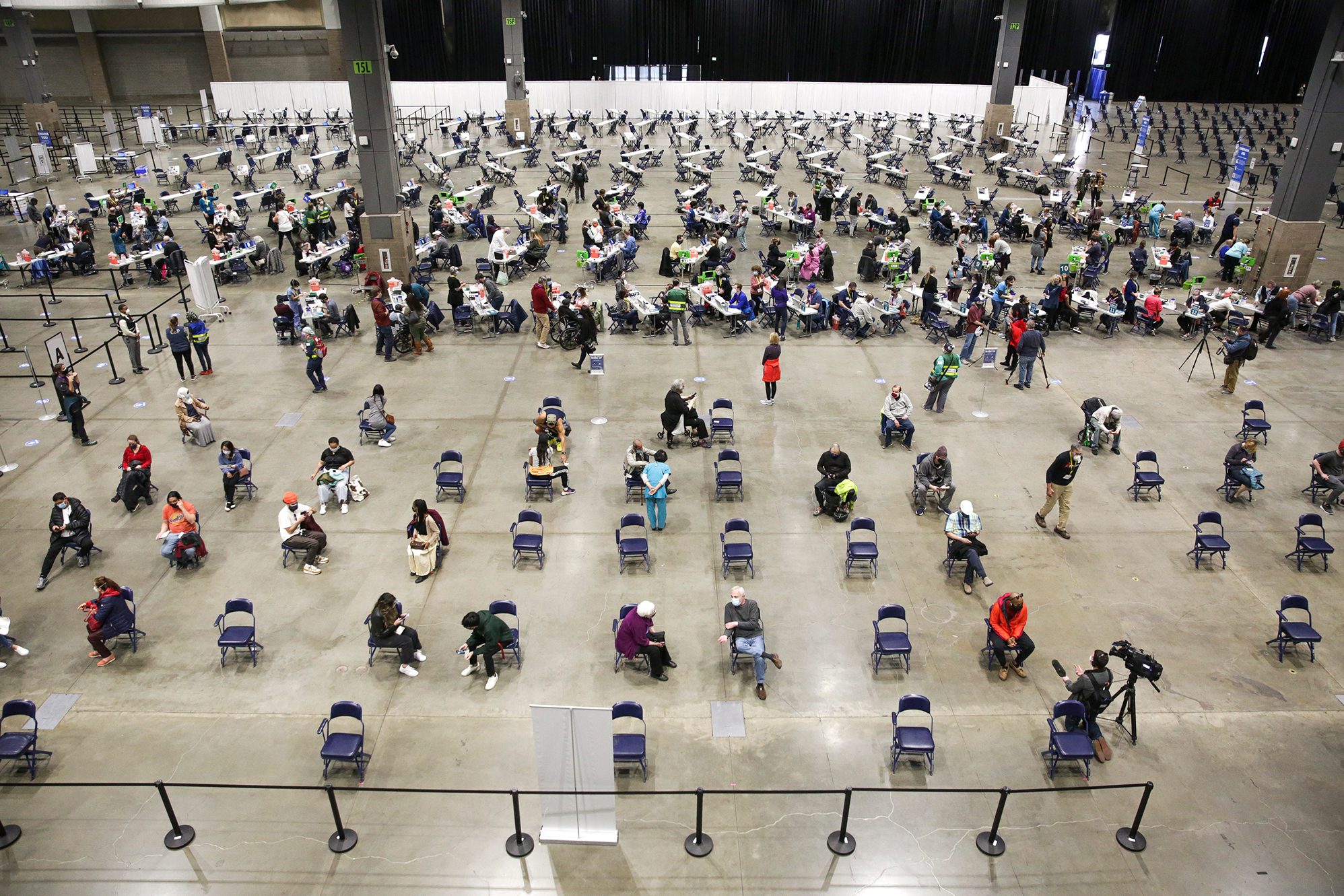 A mass vaccination site at the Lumen Field Event Center in Seattle had plenty of takers for the COVID-19 vaccine when it opened in mid-March. Though some relatively rare cases of coronavirus infection have been documented despite vaccination, &quot;I don't see anything that changes our concept of the vaccine and its efficacy,&quot; says Dr. Anthony Fauci of the National Institutes of Health. (AFP via Getty Images)