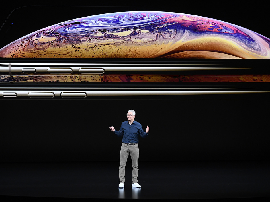 Tim Cook, chief executive officer of Apple Inc., speaks during an event in 2018. Apple is one of 310 companies calling on the Biden administration to slash carbon emissions. (David Paul Morris/Bloomberg via Getty Images)