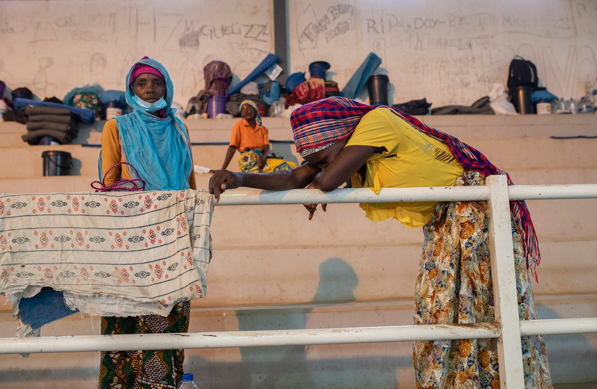 People fleeing Palma gather in a sports center in the town of Pemba, 250 miles south of Palma on April 2. Many have seen friends and family beheaded or shot and their homes burned. (AFP via Getty Images)