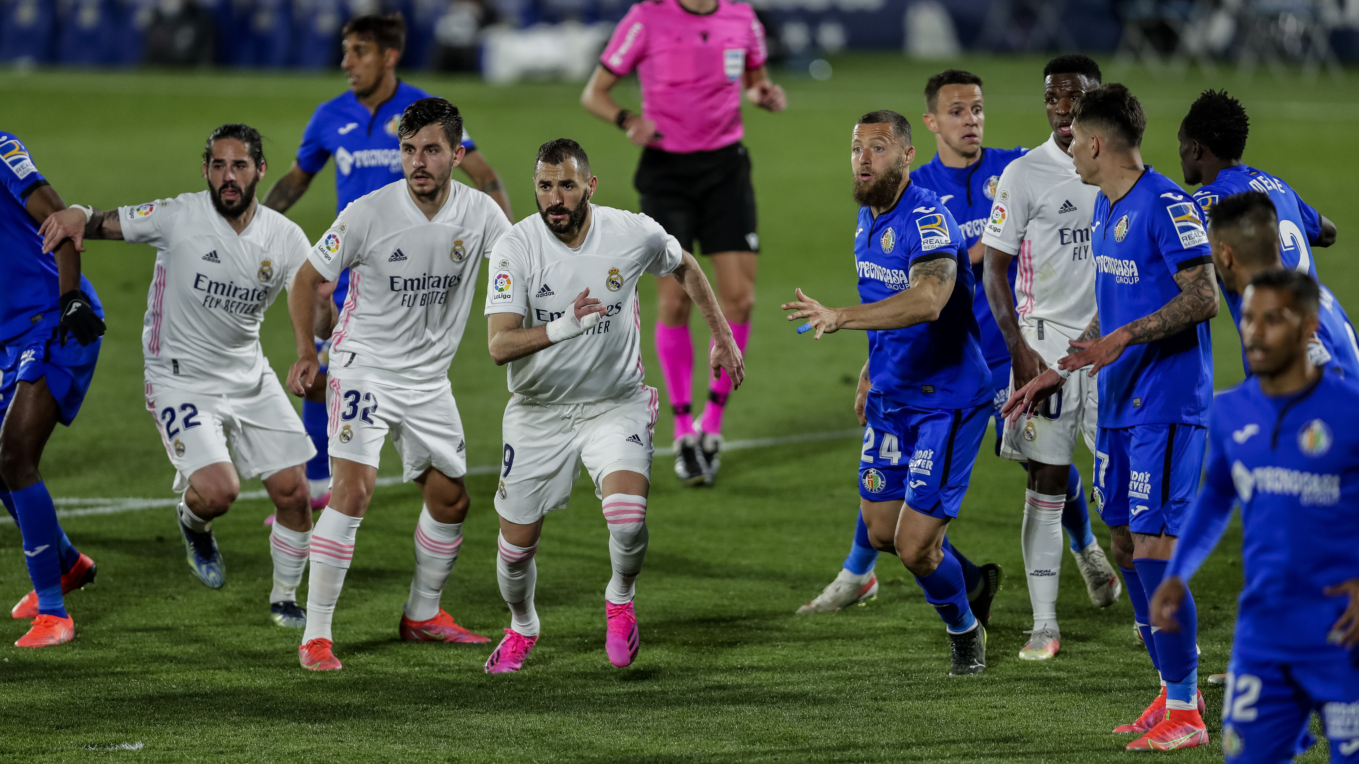 Real Madrid players, left, duel with Getafe players during the Spanish La Liga soccer match at the Alfonso Perez stadium in Getafe, Spain, Sunday.