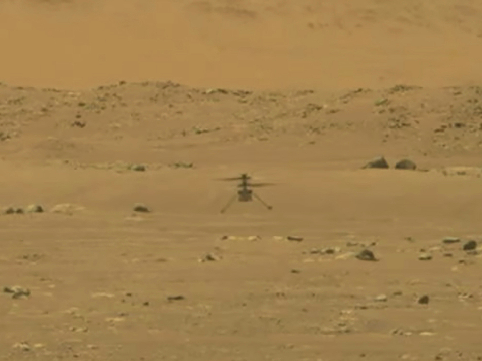 NASA's 4-pound, experimental helicopter Ingenuity lands on the surface of Mars on Monday. (NASA via AP)
