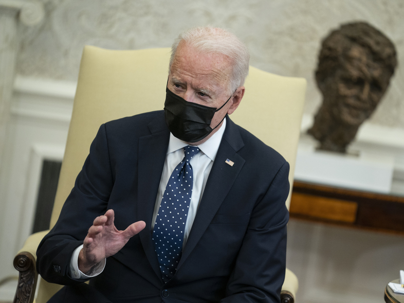 President Biden appears in the Oval Office on Tuesday, where in brief remarks to the press he said he was praying that the verdict in the George Floyd case "is the right verdict." (Evan Vucci/AP)