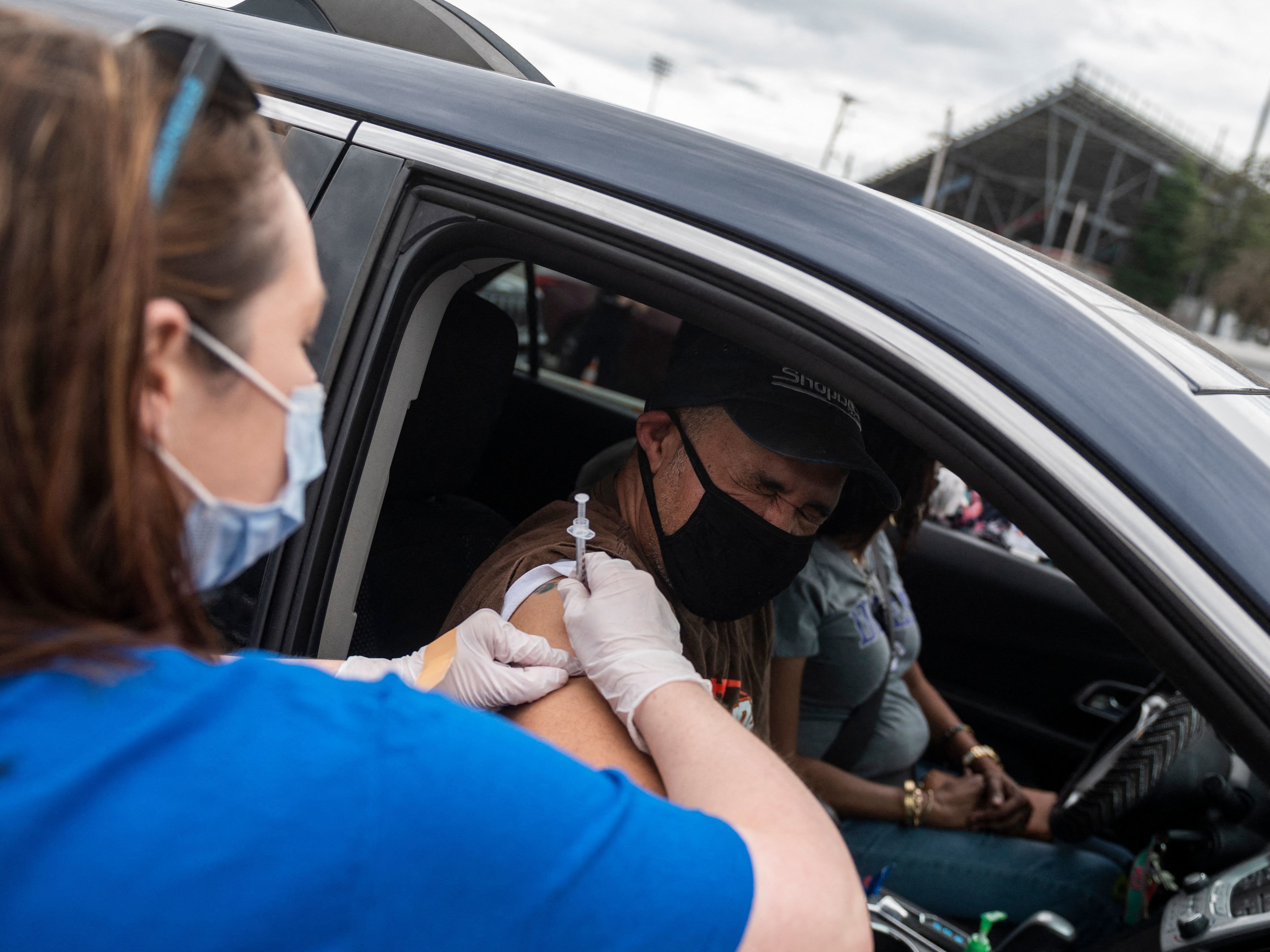 A nurse administers a COVID-19 vaccine in Ridgeway, Va., in March. (AFP via Getty Images)