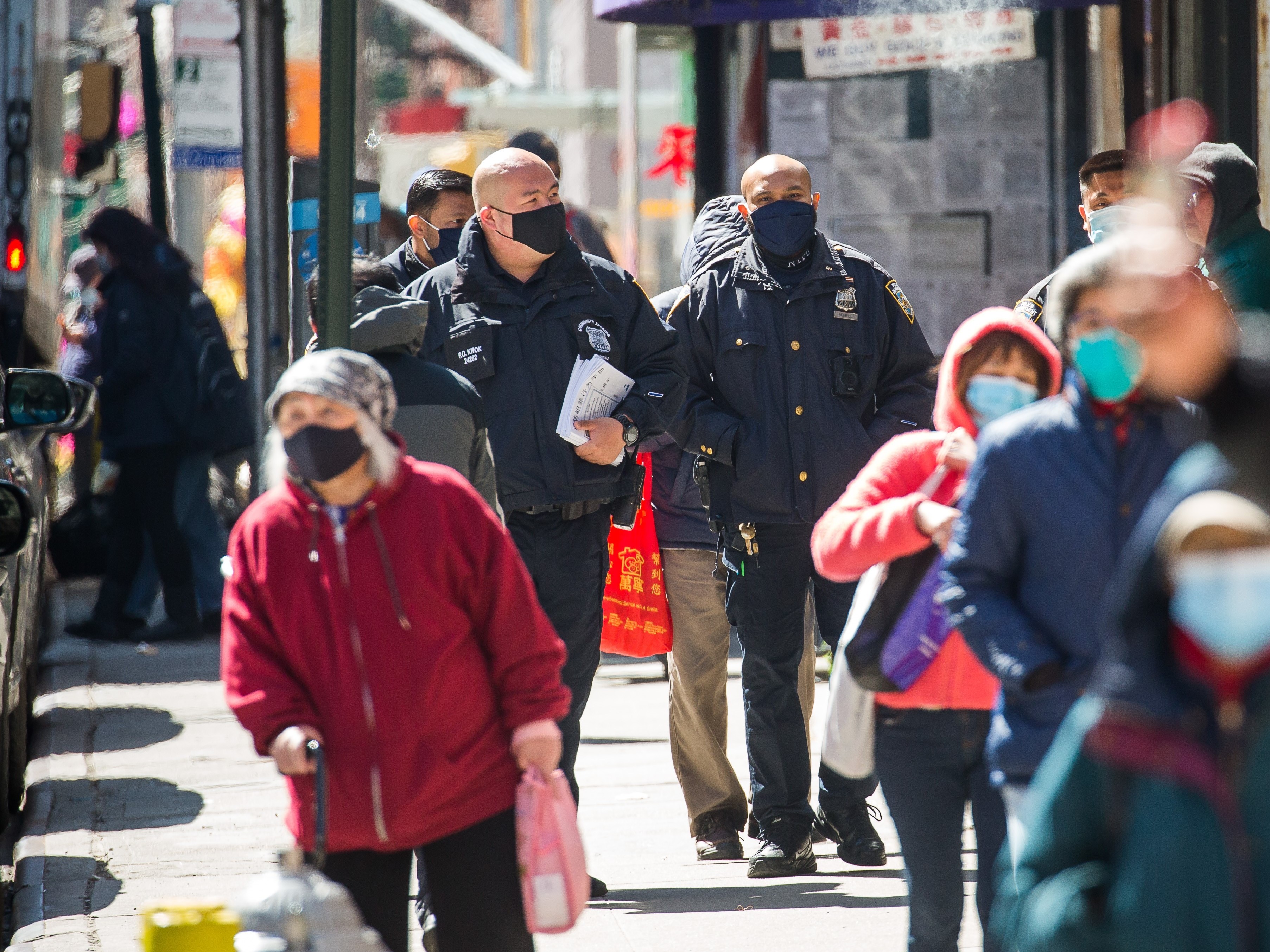 New York Police Department officers on patrol in the Chinatown neighborhood of Manhattan last month. Foot patrols were increased following the mass shooting in Atlanta which killed eight people, six of them women of Asian descent. (Xinhua News Agency/Getty Images)