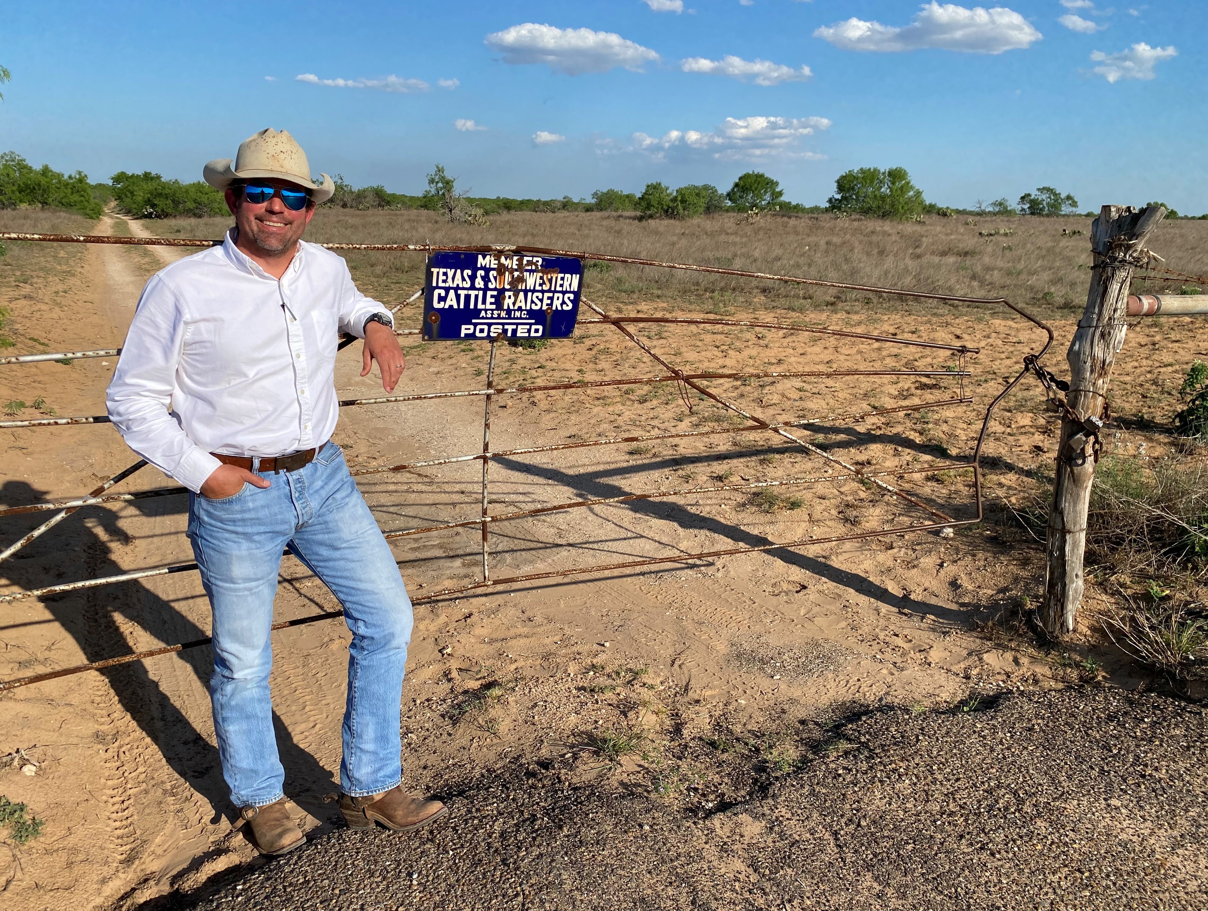 Rancher Whit Jones figures he's spent more than $30,000 since January fixing fences and gates, like this one, that human smugglers busted through in order to &quot;bailout.&quot; (NPR)