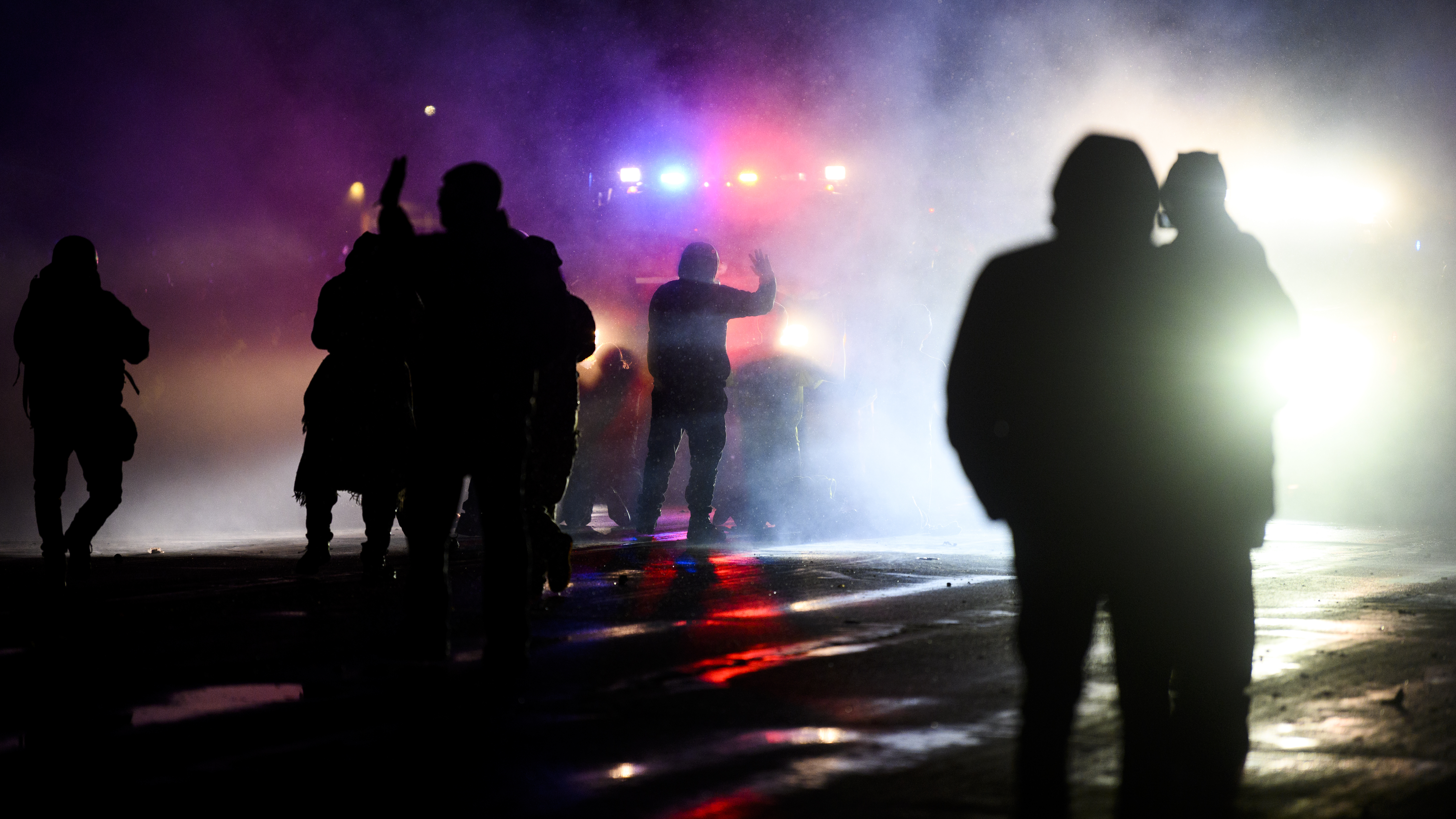 Protesters confront law enforcement on April 13 outside the police headquarters in Brooklyn Center, Minn., over the fatal shooting of 20-year-old Daunte Wright by an officer. The NAACP Legal Defense And Education Fund is asking the Justice Department to suspend local police grants, citing ongoing killings of Black people like Wright by police. (Getty Images)
