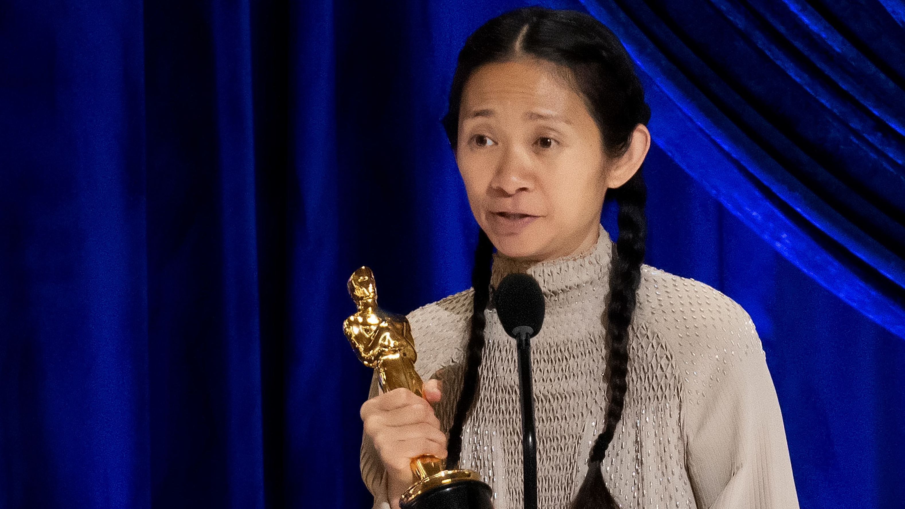 Chloé Zhao accepts the Oscar for best director during Sunday night