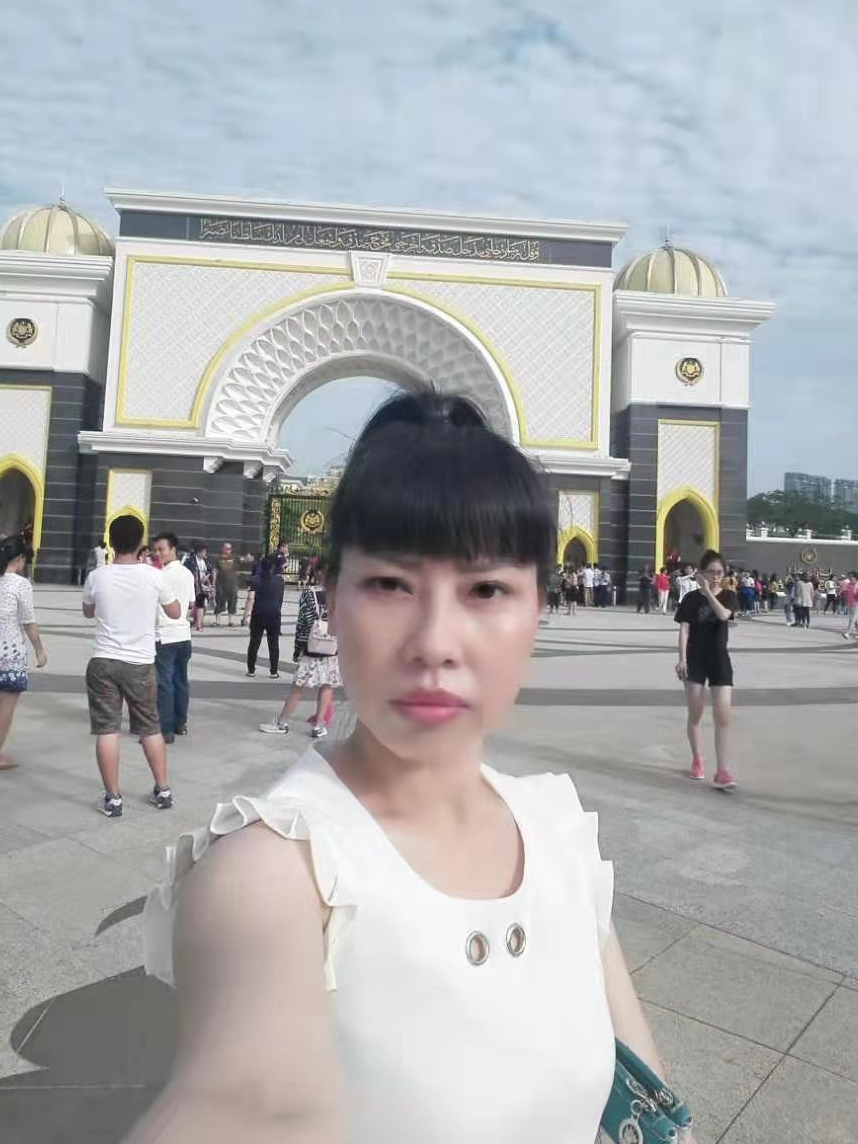 A selfie taken by Feng Daoyou. Her older brother Feng Daokun believes she traveled to Hong Kong before flying to the U.S., from where she first contacted him in 2016. Unlike the rest of her family, she did not marry, and seemed to relish venturing far from home. &quot;She could do anything she put her mind to. She was tough. She never gave up. That was just her personality,&quot; her brother says. (Feng Daokun)