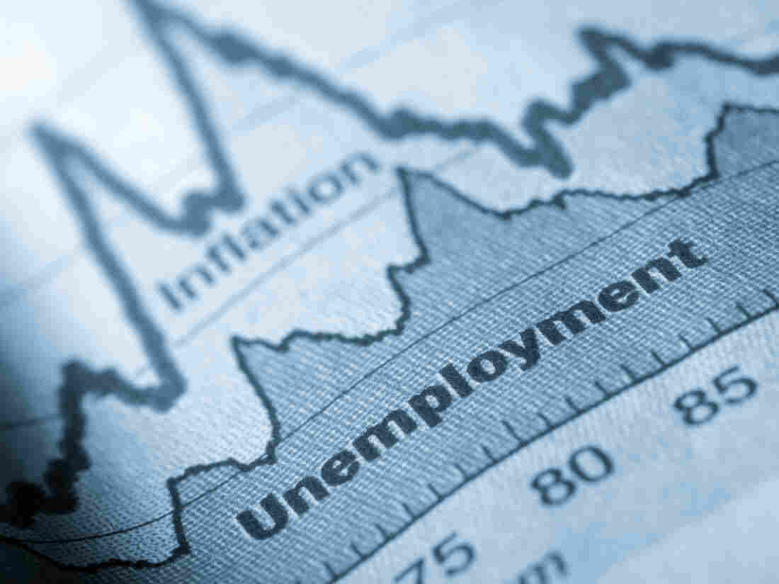 Business graph unemployment and inflation in newspapers