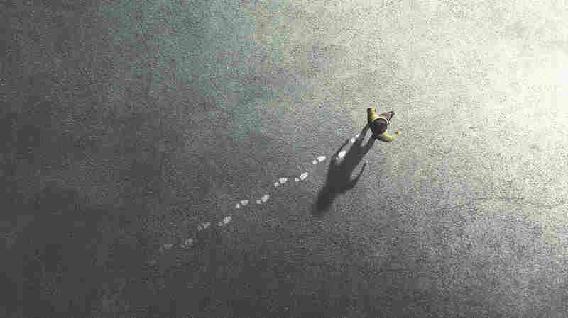 man walking in the streets leaving footsteps on the ground, past concept