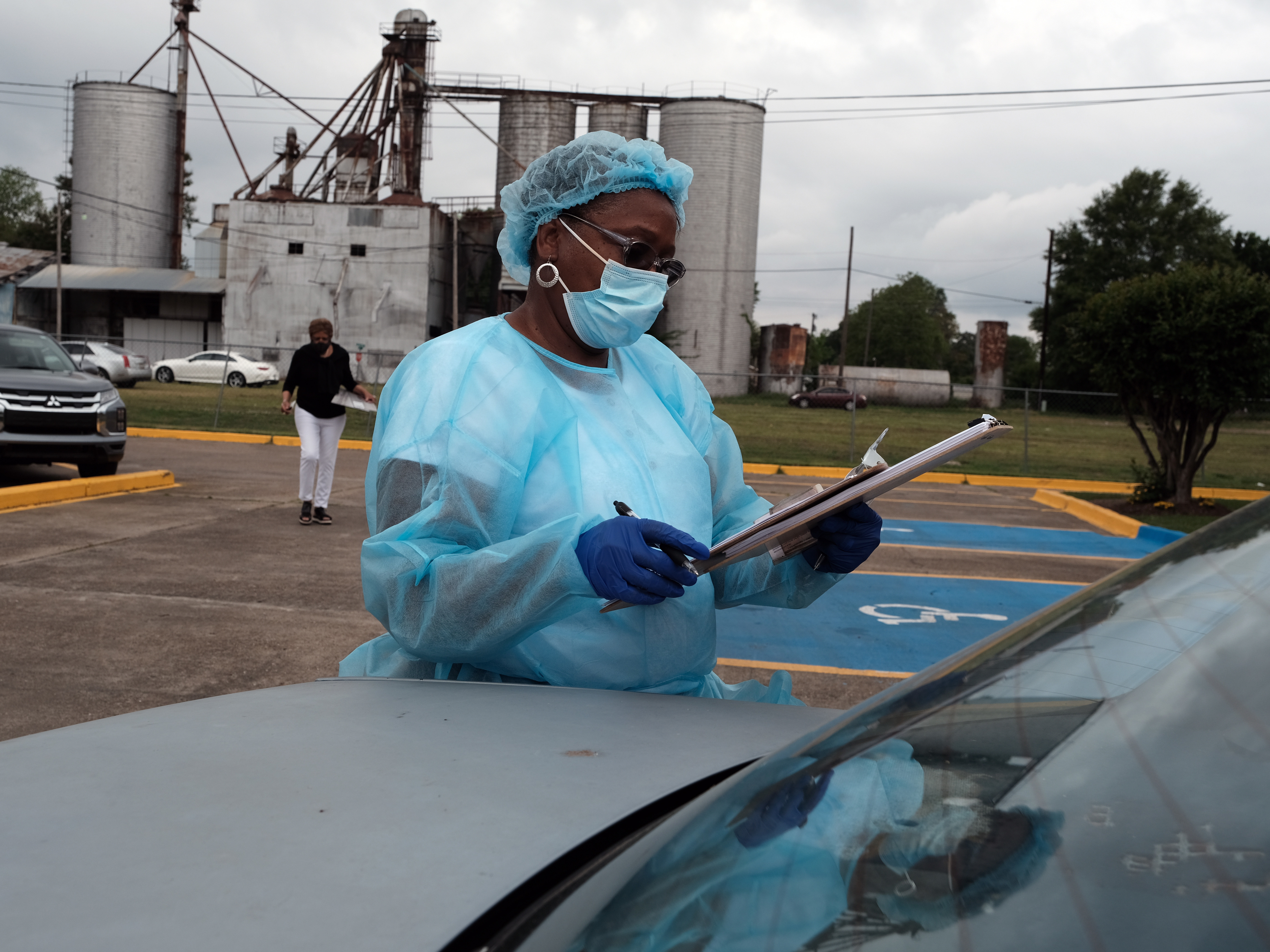 Medical workers with Delta Health Center prepare to vaccinate people in Leland, Miss., last week. In some places, rural hospital workers have been slow to get the vaccine themselves. (Getty Images)