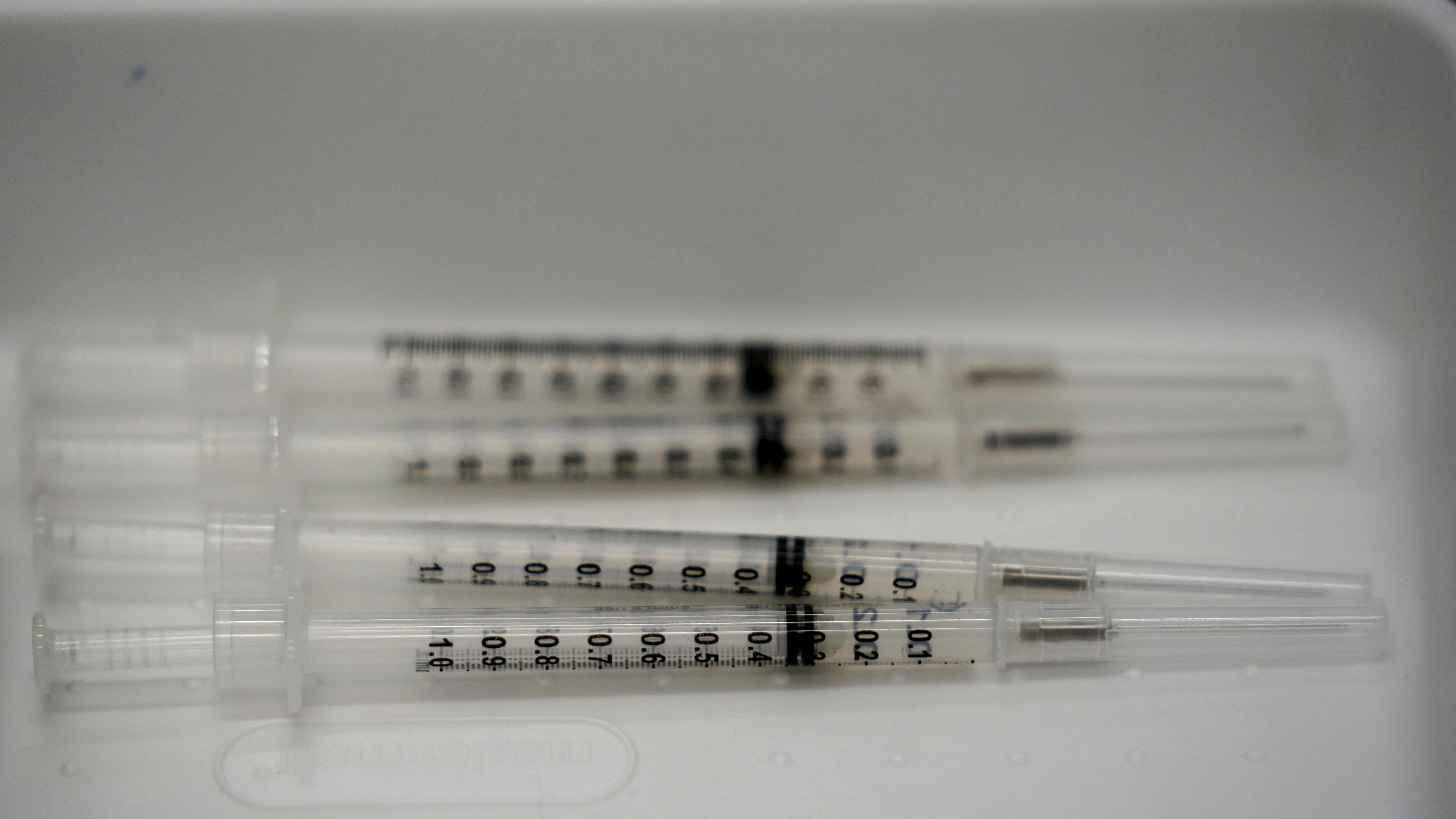 Syringes filled with the Pfizer-BioNTech COVID-19 vaccine are shown in April at the Christine E. Lynn Rehabilitation Center in Miami.